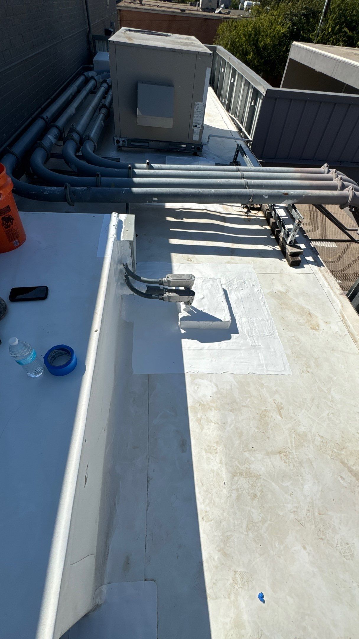 Commercial Roofing Repair using TRP #924 Eterna-Sil Premium Silicone Roof Coating by Harvey Roofing & Construction