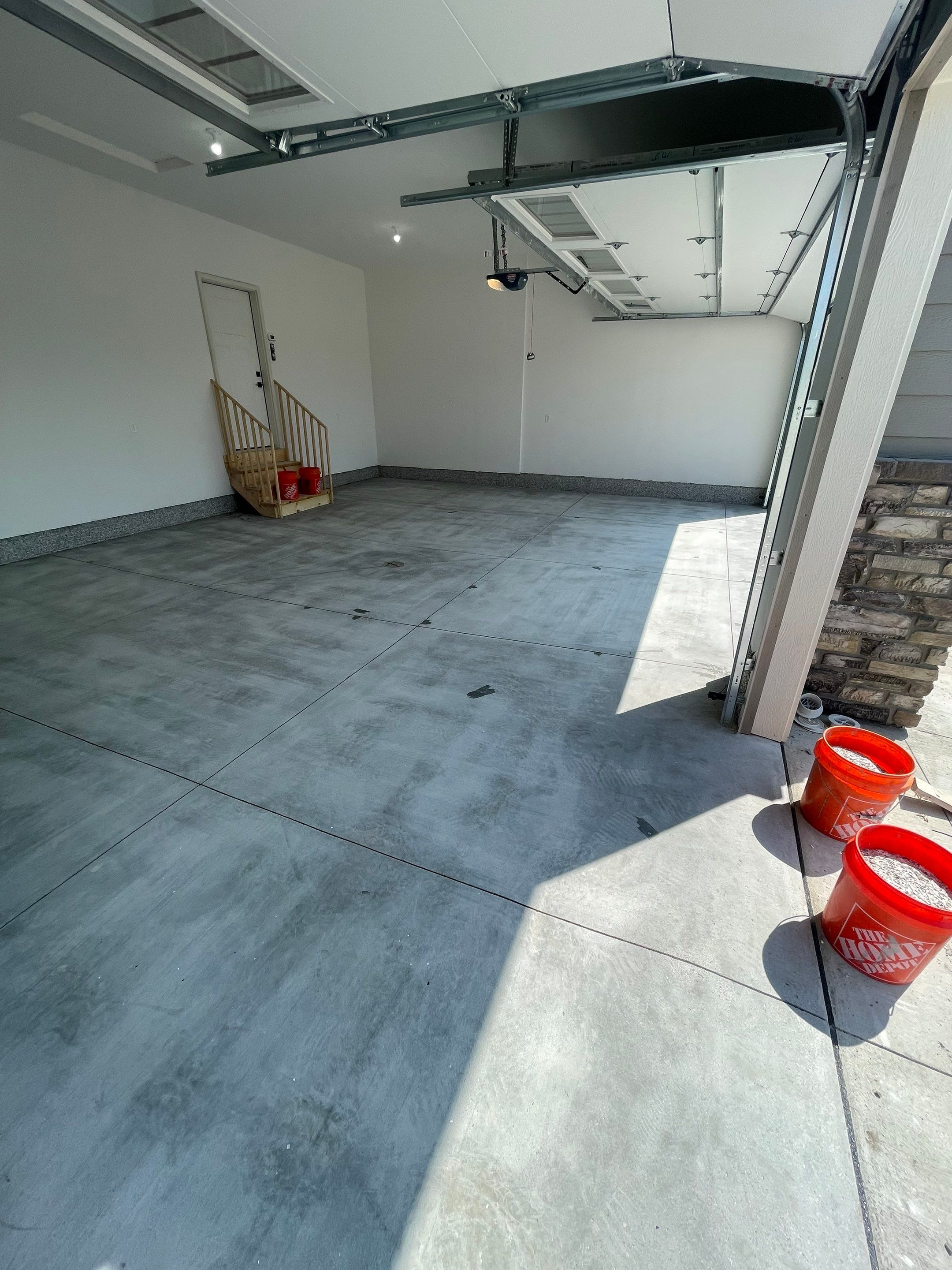 Grey Speckled Garage Floor Coating in Sioux Falls by Select Painting, Coatings & Garage Cabinets