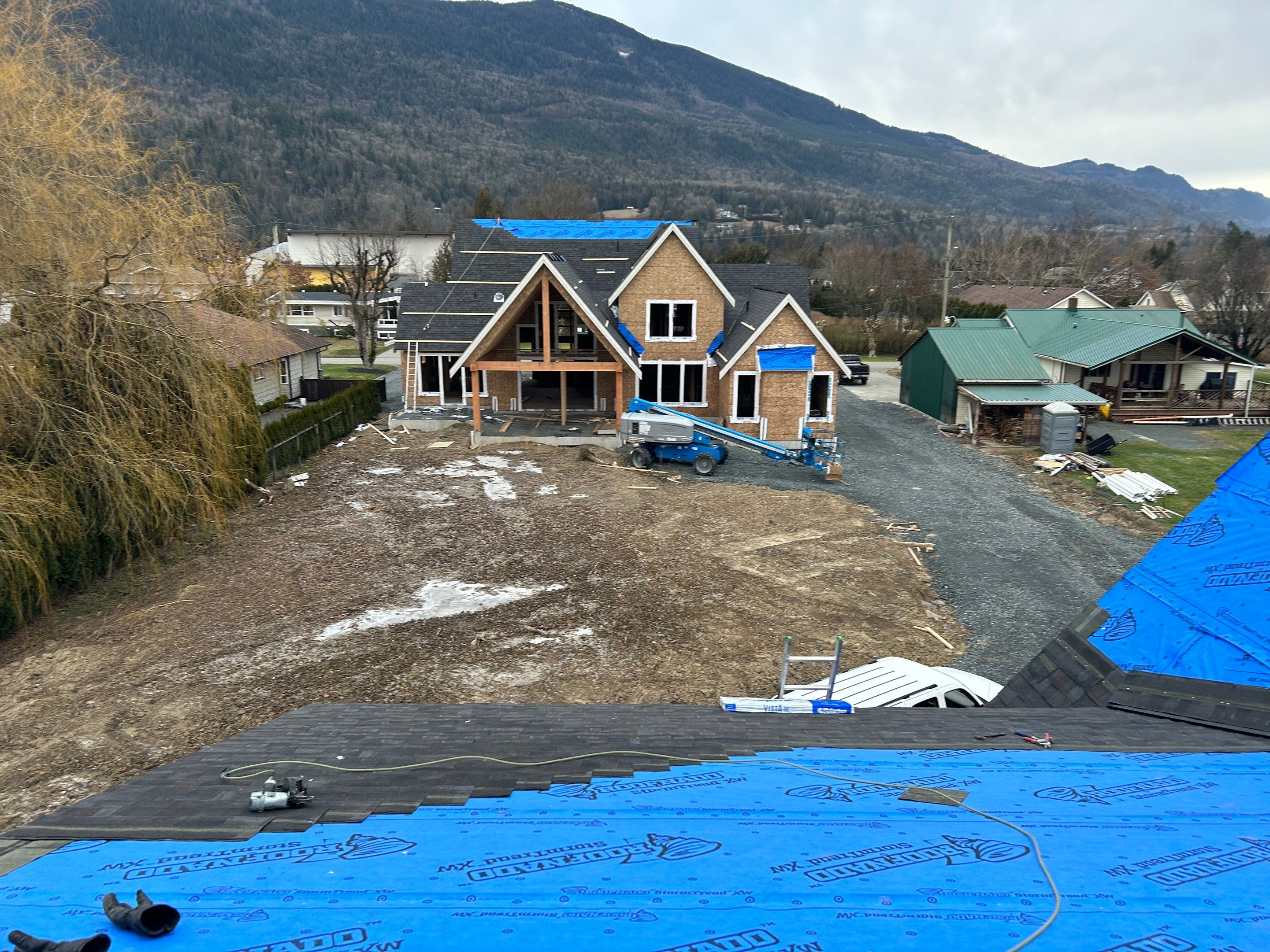 Residential Roofing Installation using Malarky Vista Shingles and Prolok Metal  by Top Notch Roofing Inc