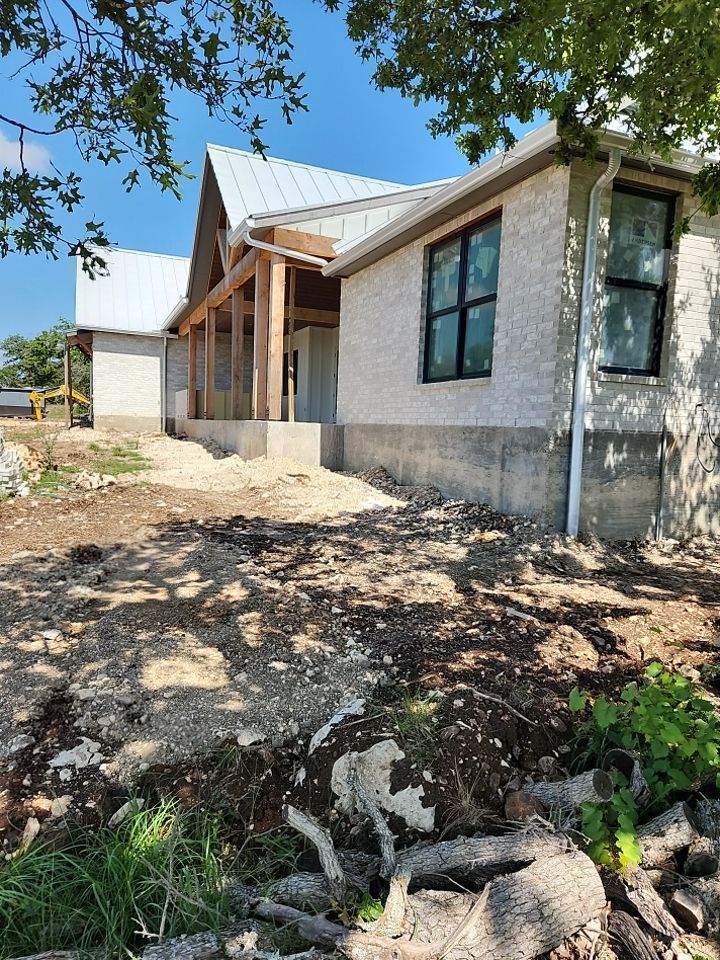 Residential Rainwater Collection System - Pioneer 40K gallon water tank in Mangrove Green by Hill Country Rain Water