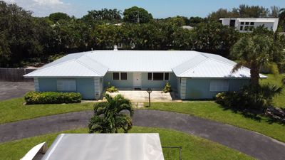 Residential Roofing Installation using 1" Nail strip metal roof