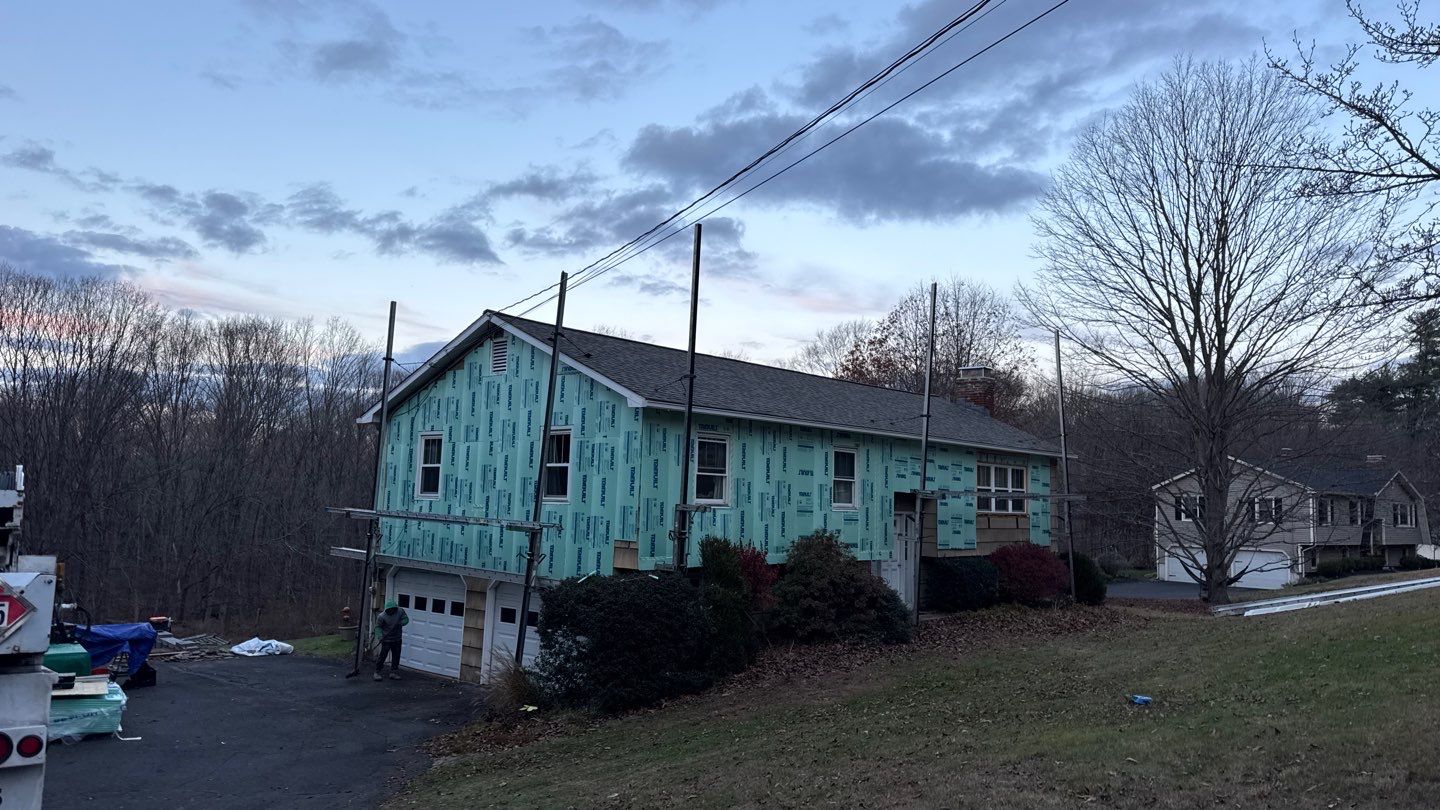 Striking siding update with Cert. Monogram D/4 x 12'6" clapboard, Deep Mineral by DiGiorgi Roofing and Siding Inc