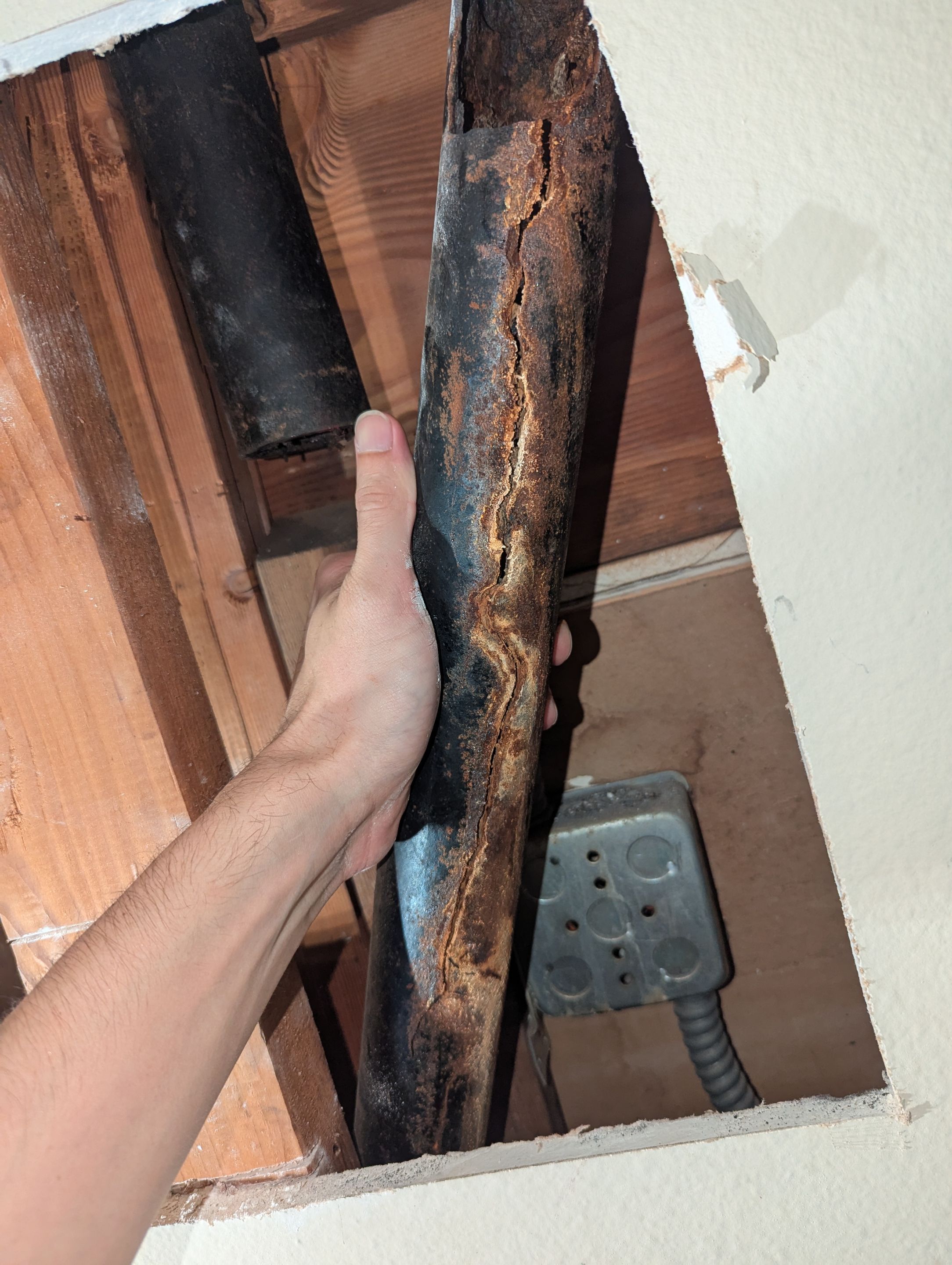 Cracked Cast Iron Line in the wall by Professional Plumbing Inc 