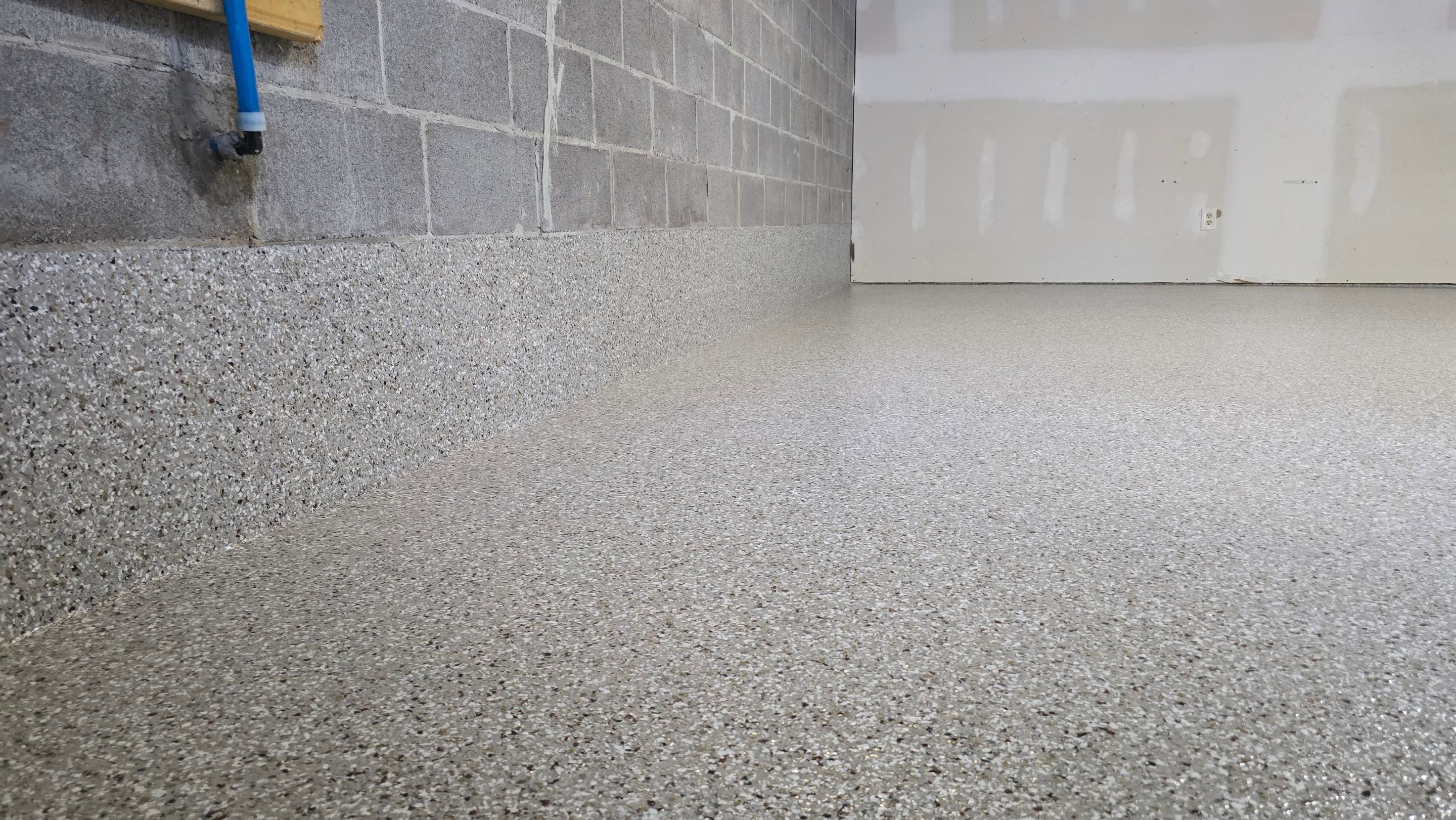 Garage & Porch Using Creekbed by Elite Floor Solutions