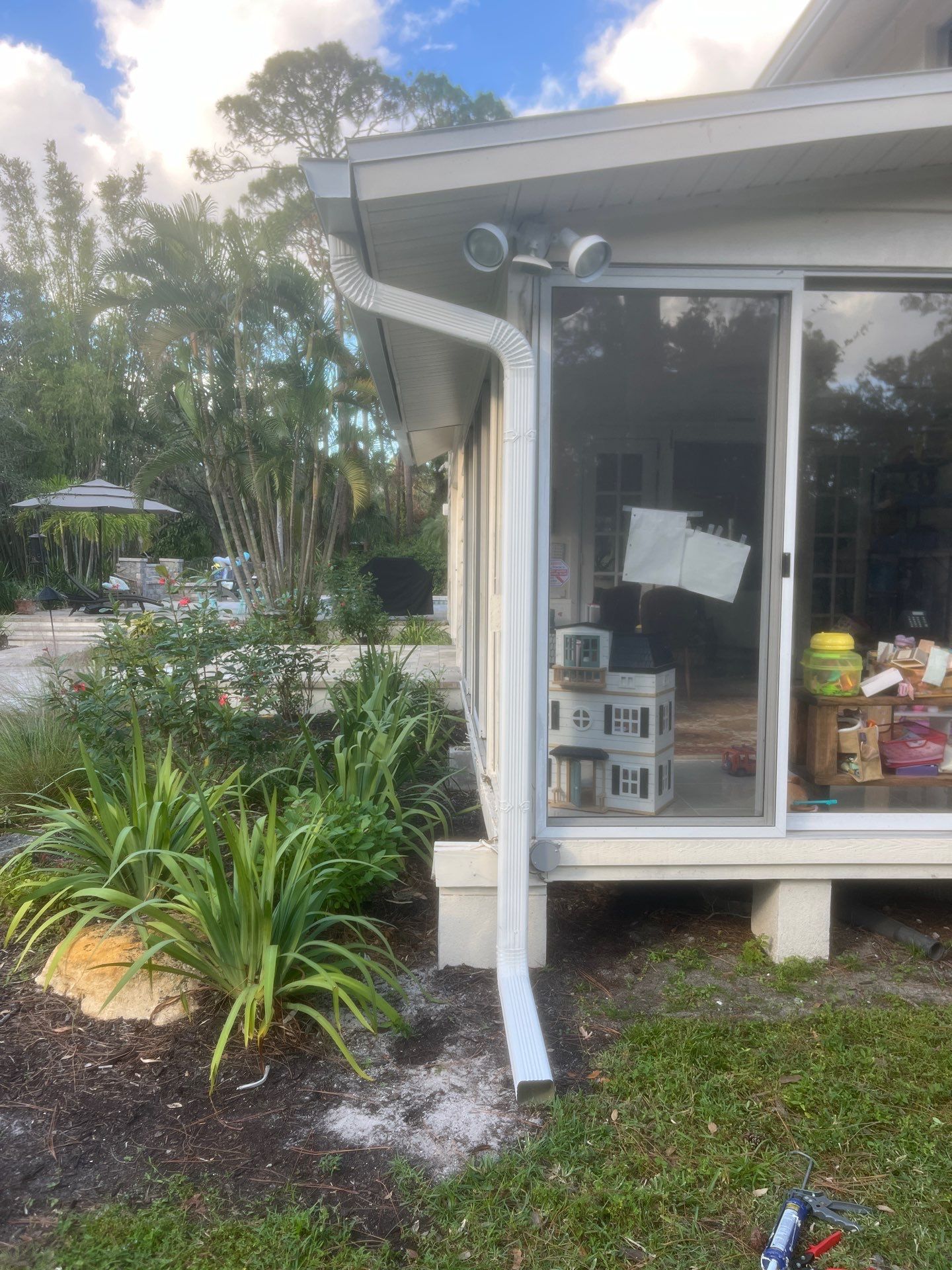 White 6-Inch Seamless Gutters Installation in Sarasota FL by Gutter Professors