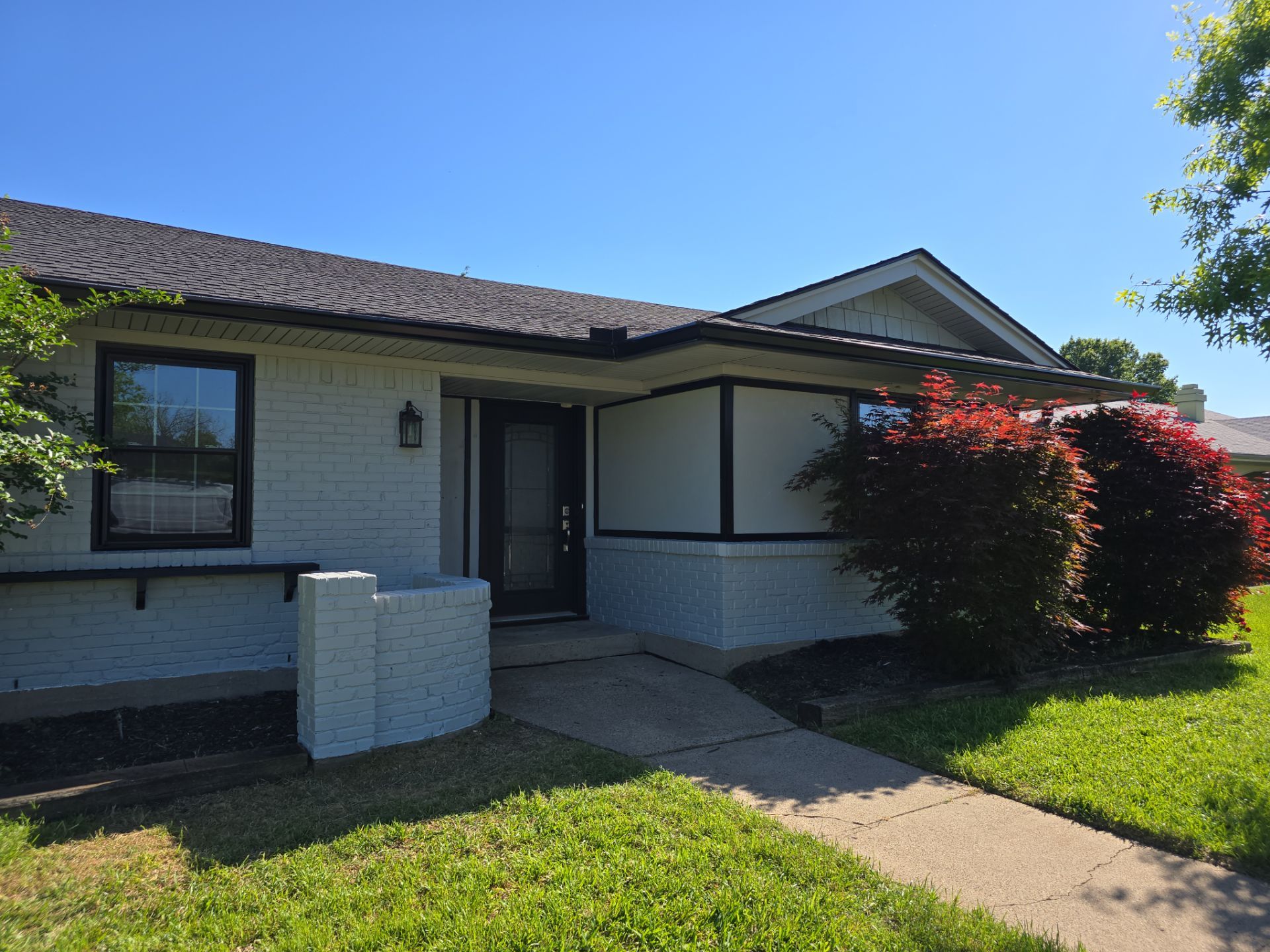 Exterior Home Paint Project with Different Surfaces by SLM General Contractors & Roofing