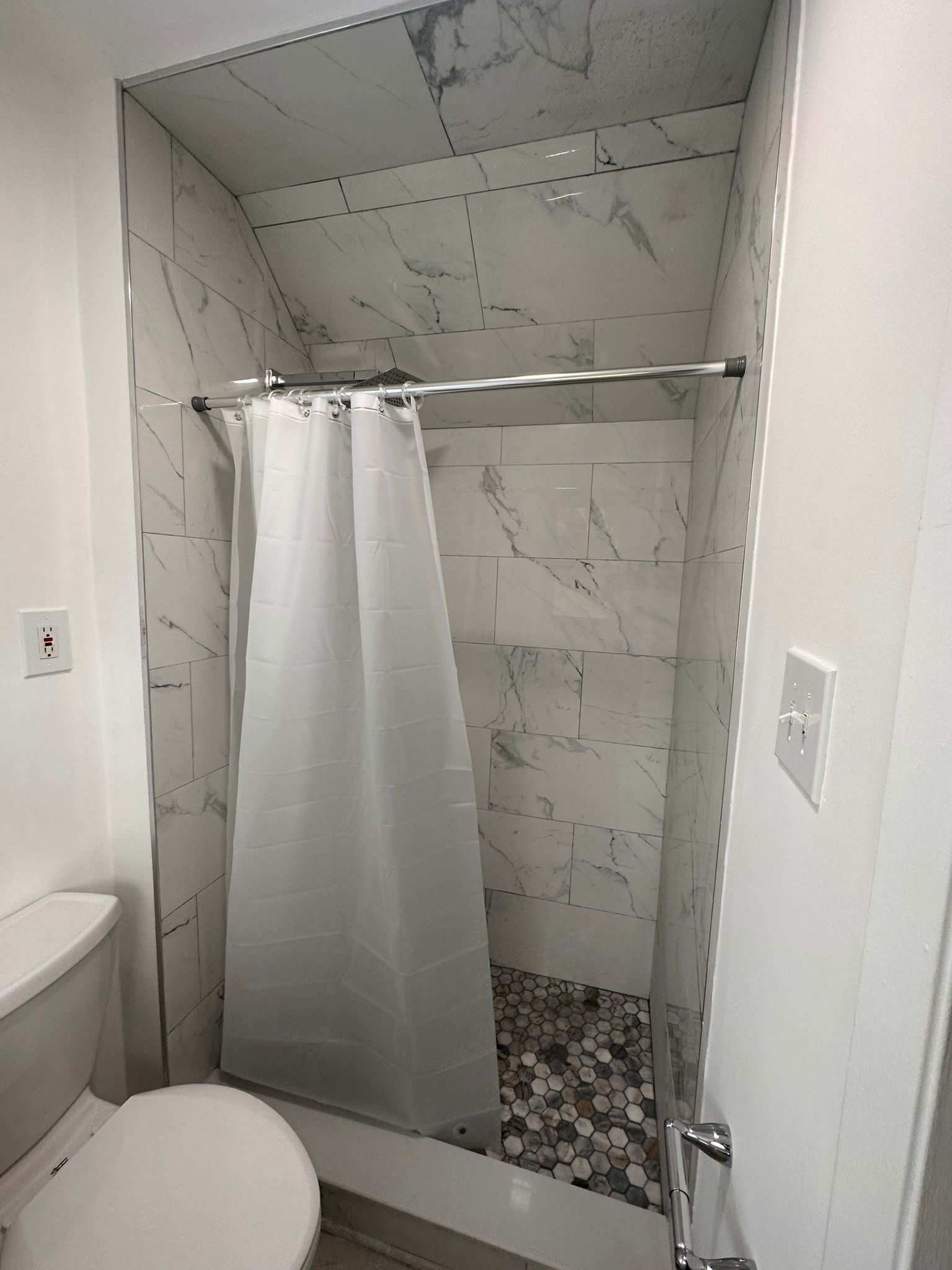 Bathroom Remodel using Tile by Home Concepts Construction