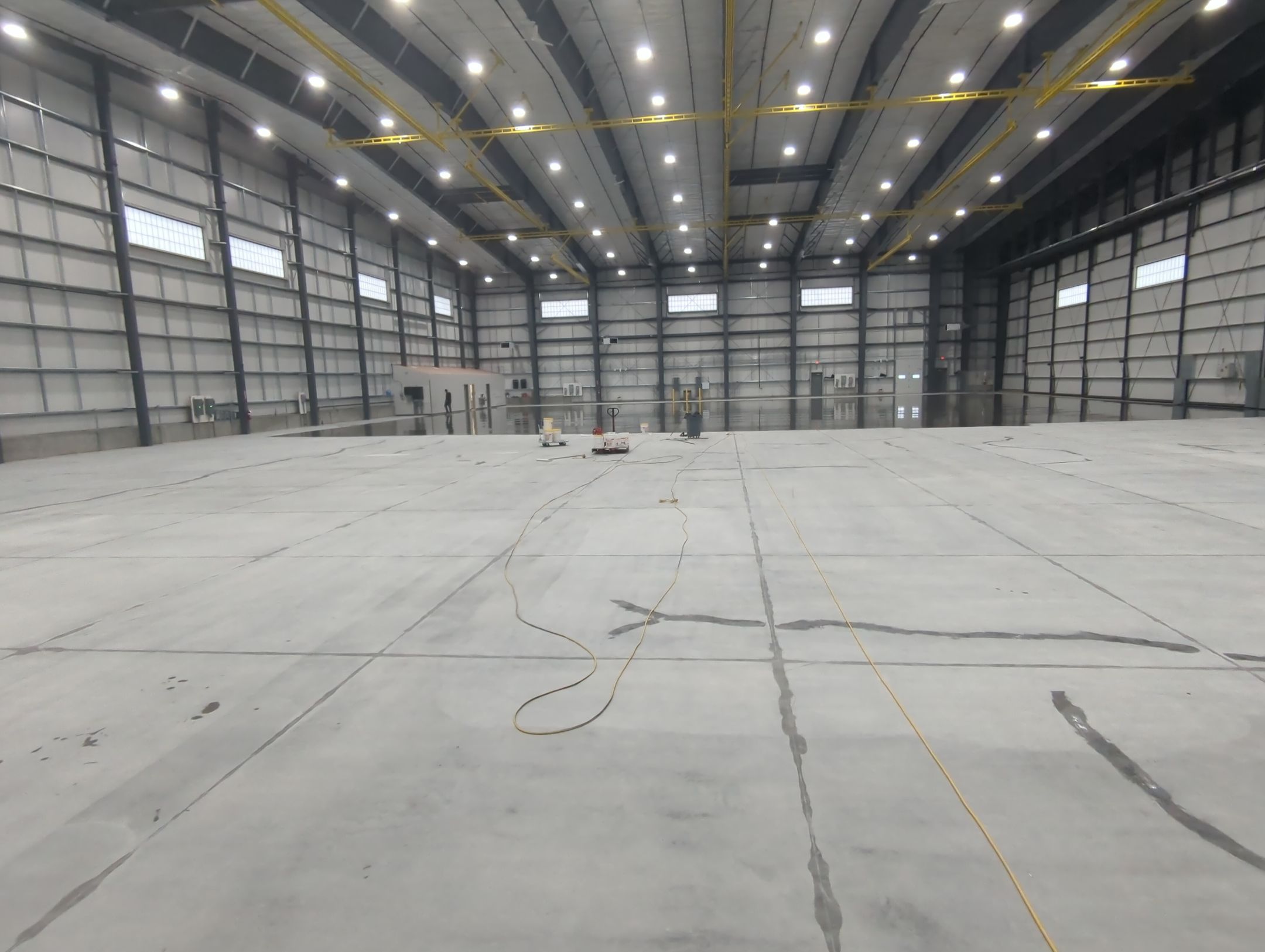 Airplane Hanger using Light Grey Commercial Penntek Epoxy by Croc Coatings, LLC