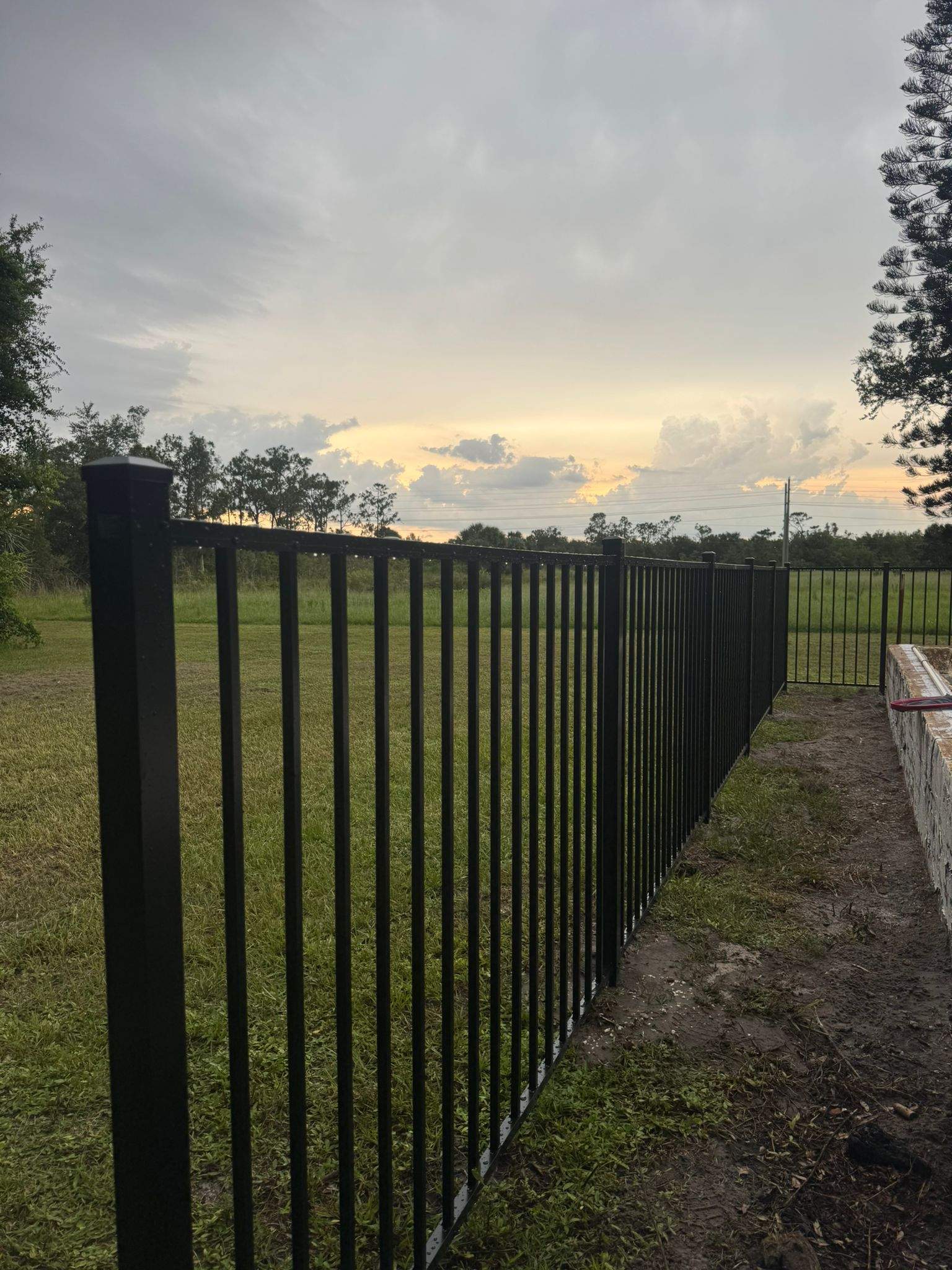 Black Aluminum Pool Safety Fence Installation in Punta Gorda by True Fence LLC