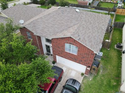 Residential Roofing Replacement and Gutter Installation in Manor