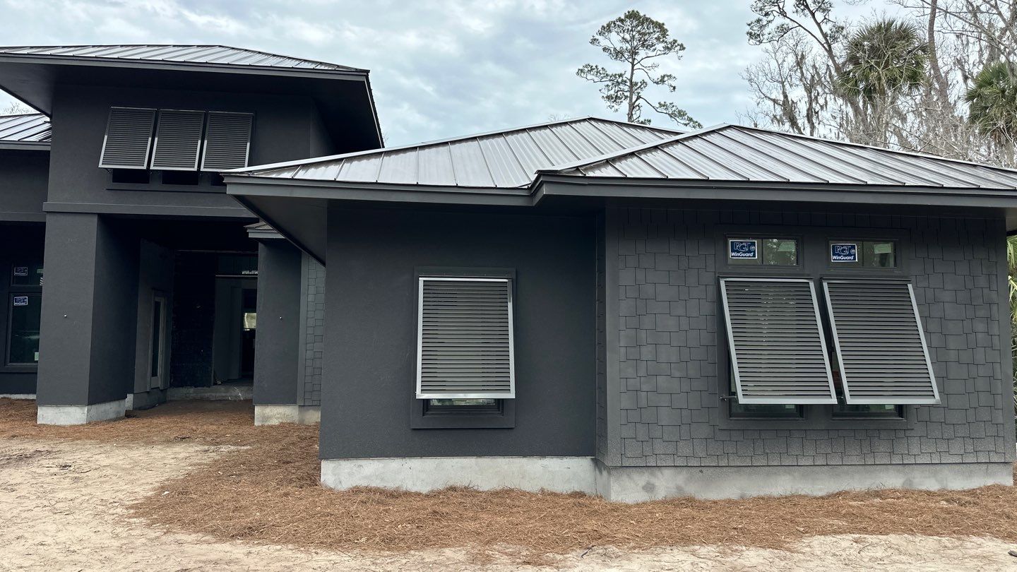 Bahama Shutters in Umbra Grey by Smart Guard Shutters