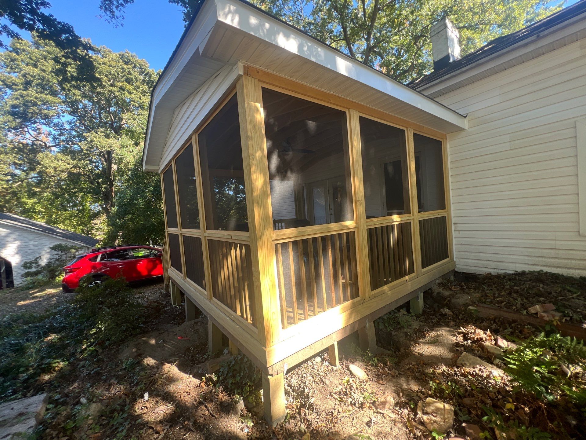 Custom Screened Porch Construction with Gable Roof in Apex by The Remodeling Company