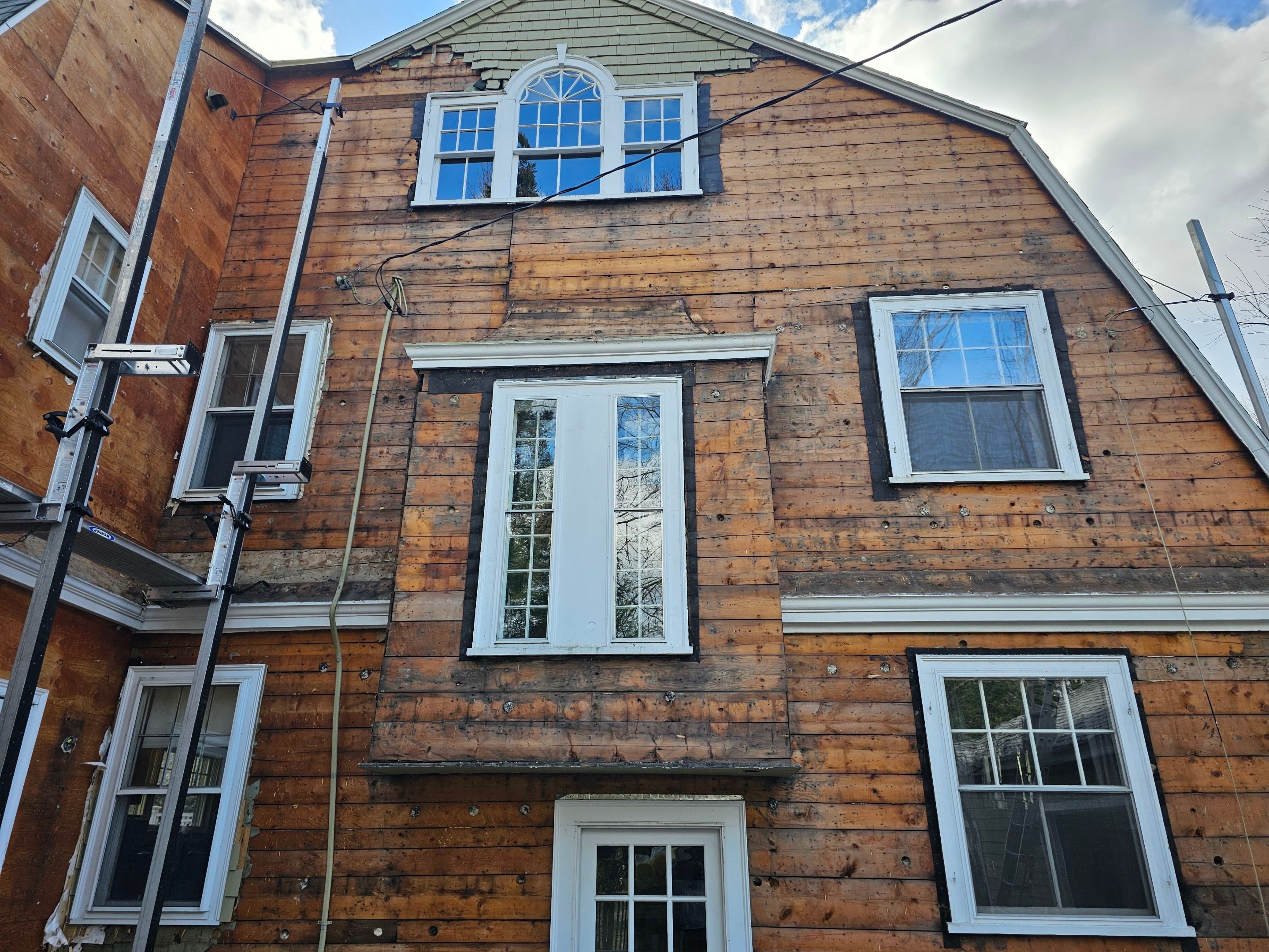 White cedar shingles and windows in Wayland, MA by UBrothers Construction