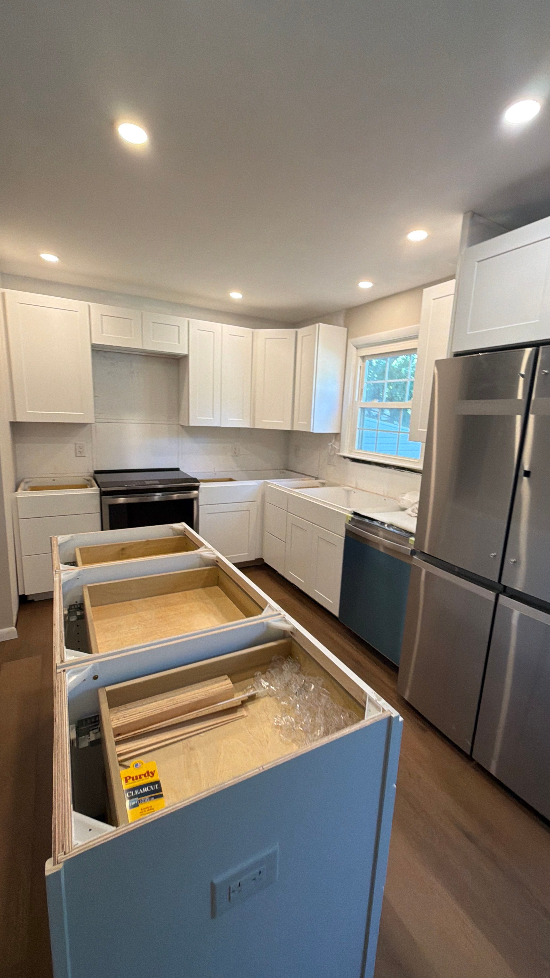 Phoenixville Kitchen Remodel with White Shaker Cabinets and Green Backsplash by Reliable General Contracting