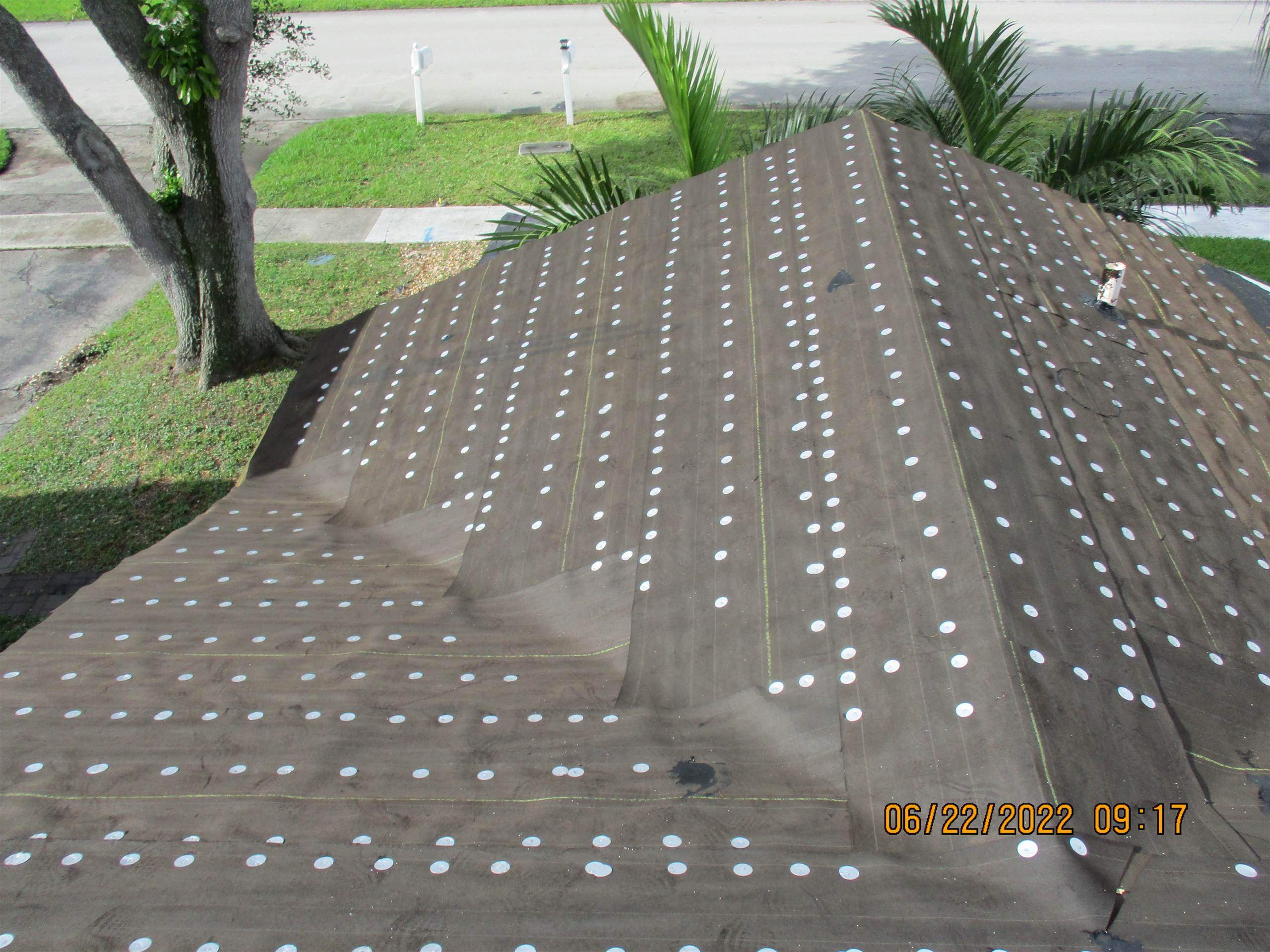 Residential Roofing Installation using 1.5" Nail Strip 24ga Solar White Kynar Coated Standing Seam Metal Panels by Morton Roofing, Inc.