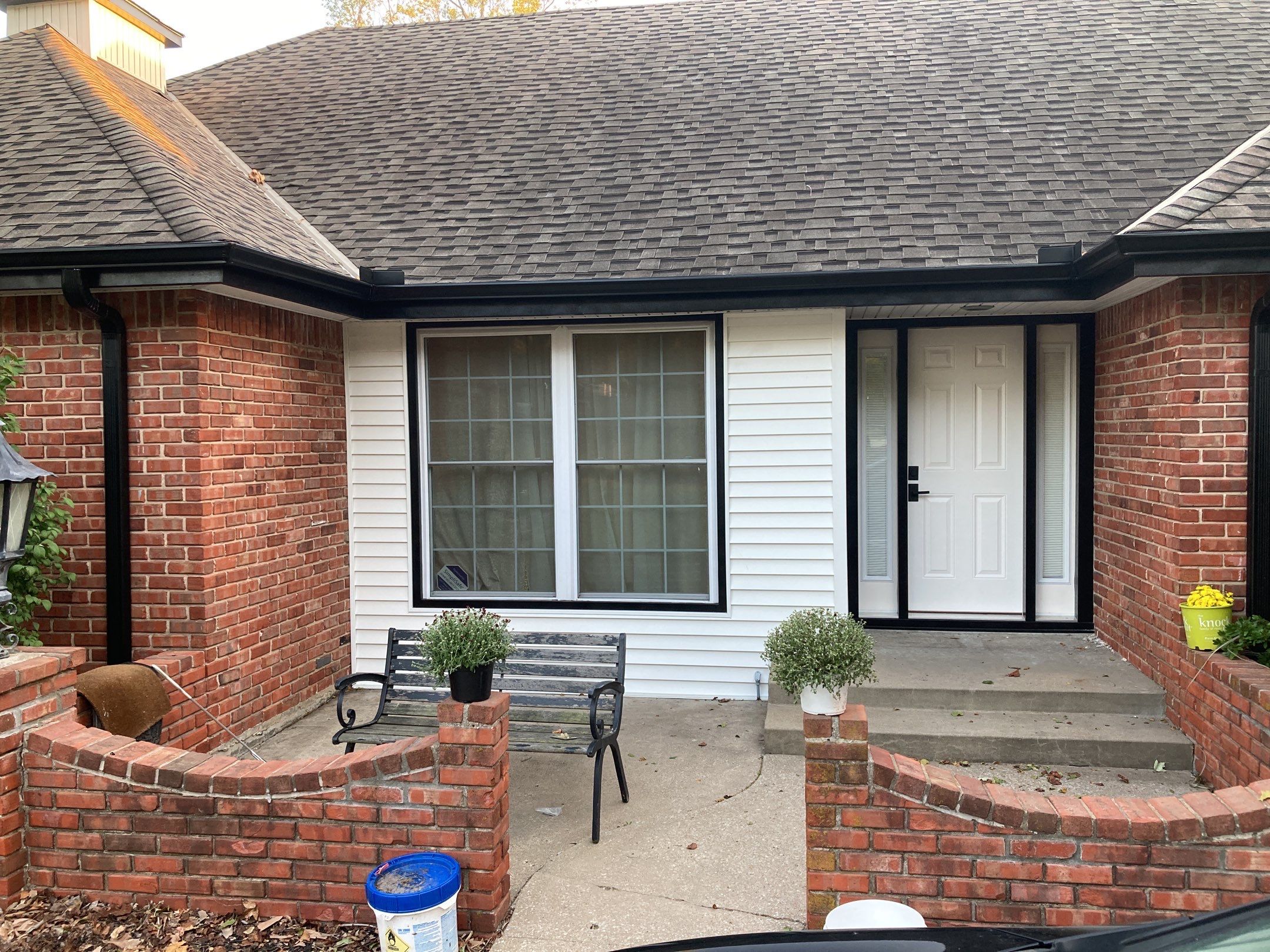 New white siding with Black trim by EEC  Windows, Siding & Roofing 