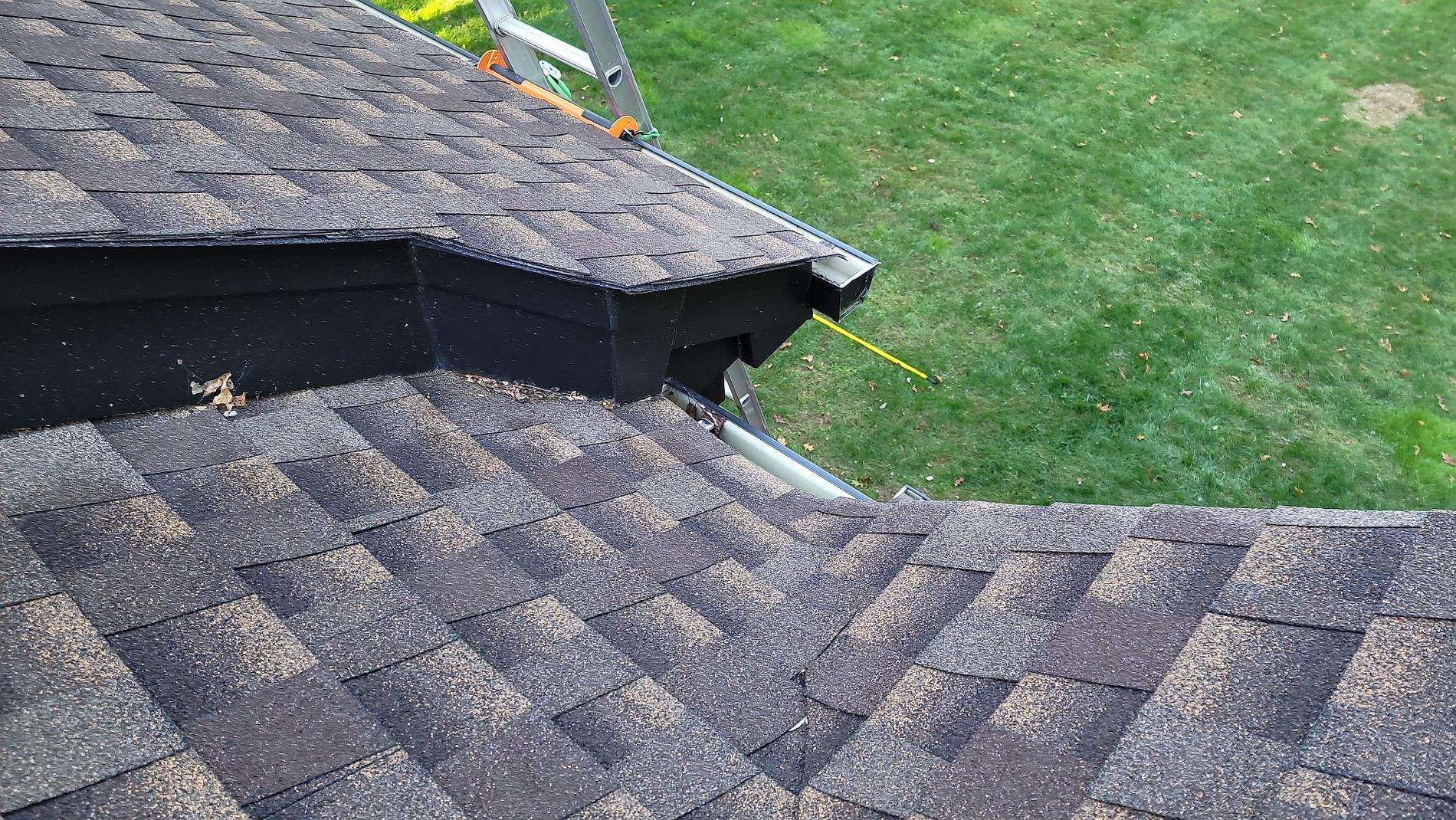 Gutter Installation using Black Gutters, soffit & fascia by Roof Right Inc