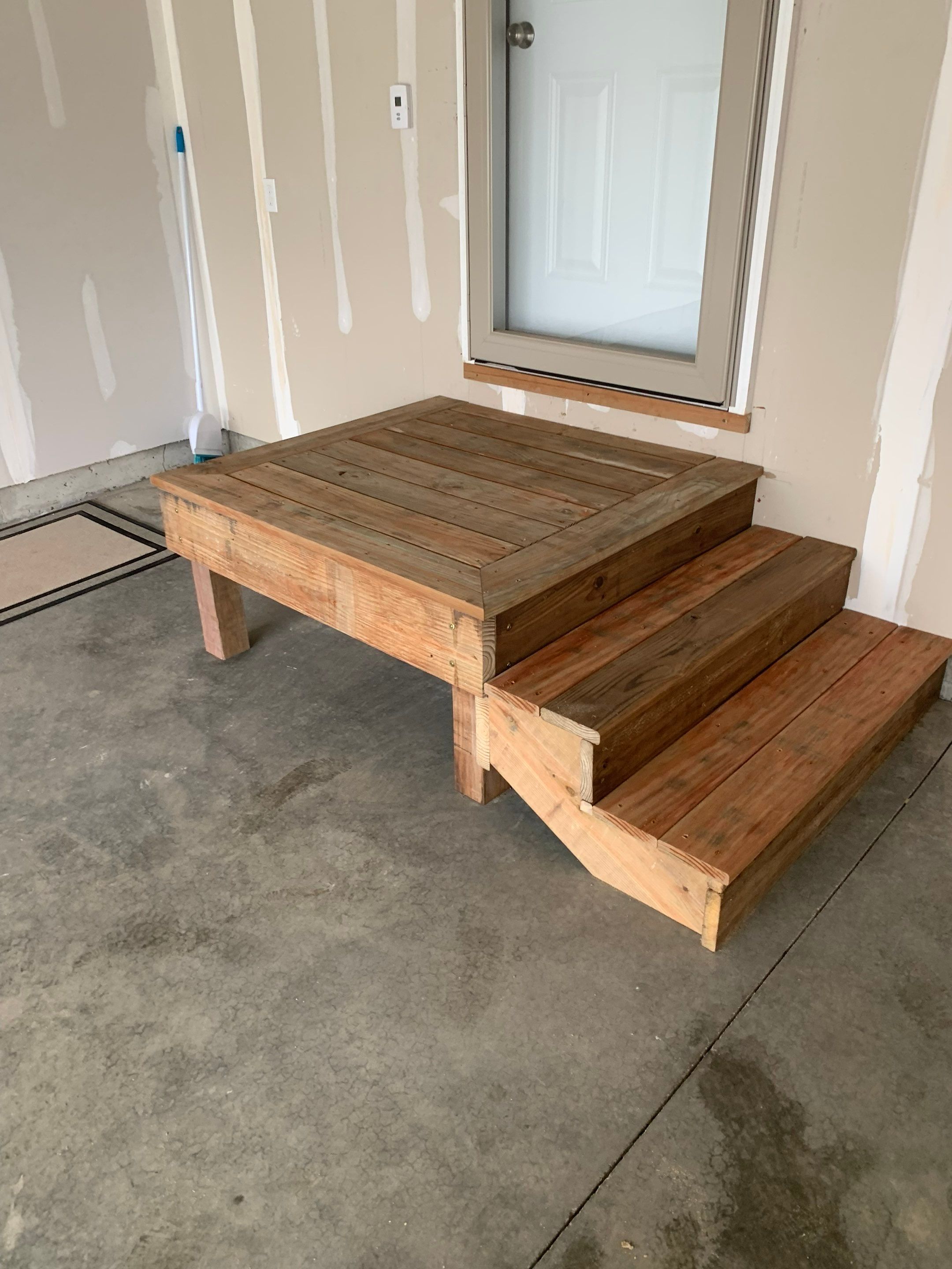 Garage Interior Finishing and Custom Wood Step Construction in Sioux Falls by Select Painting, Coatings & Garage Cabinets
