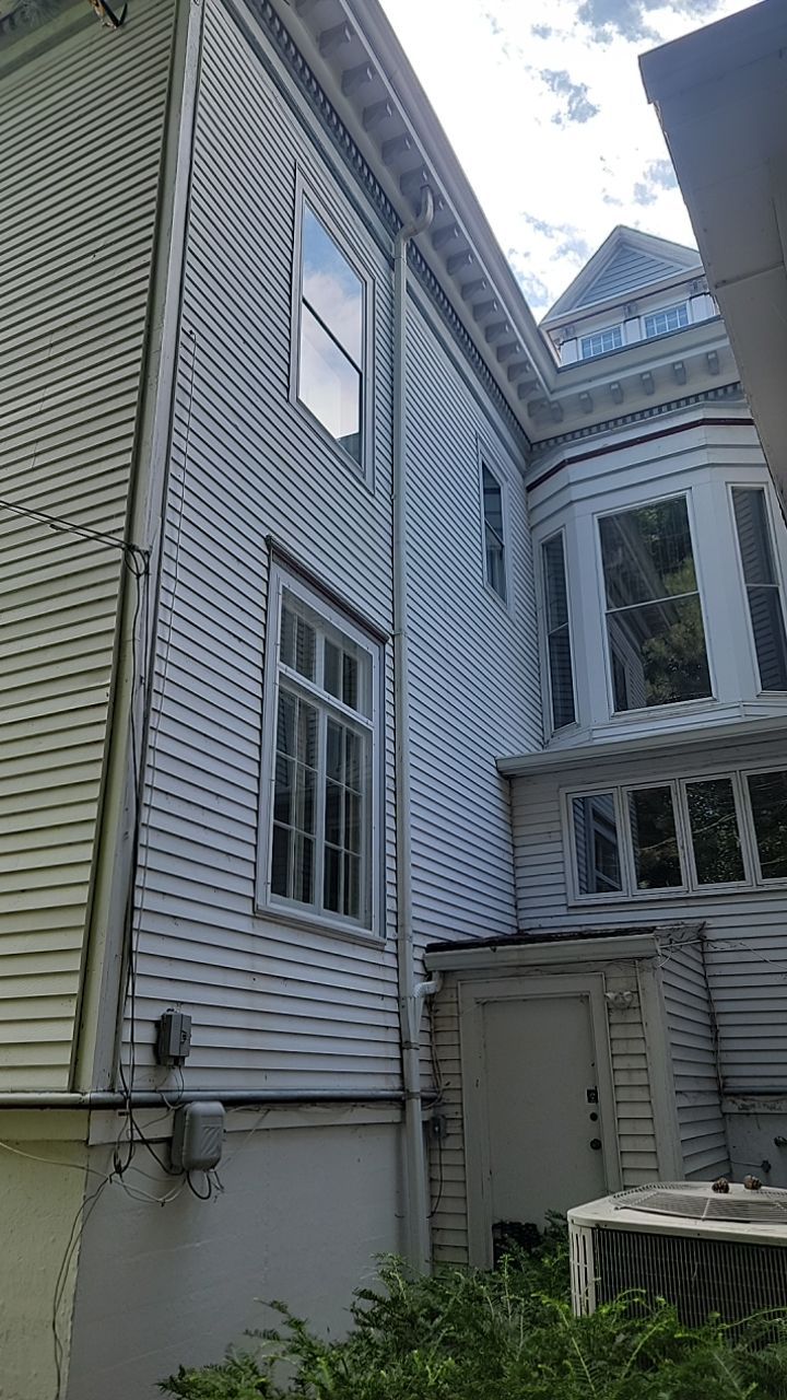 Housewashing  using Algaecide, soft wash soap by Northern Power Washing LLC.