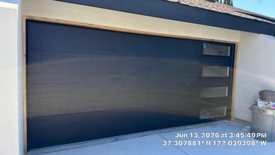 Modern Black Garage Door Installation With Vertical Windows In Cupertino