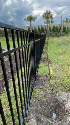 Aluminum Fence Installation using Black 3 Rail Aluminum Fence