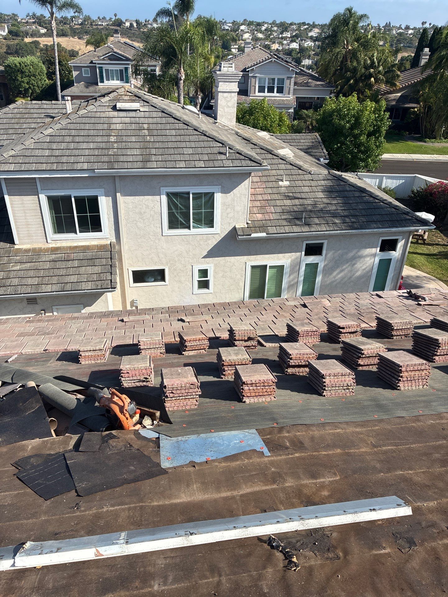 Carlsbad Concrete Tile Roof Replacement with Copper Flashing and Skylights by Reliable Roofing San Diego Inc.