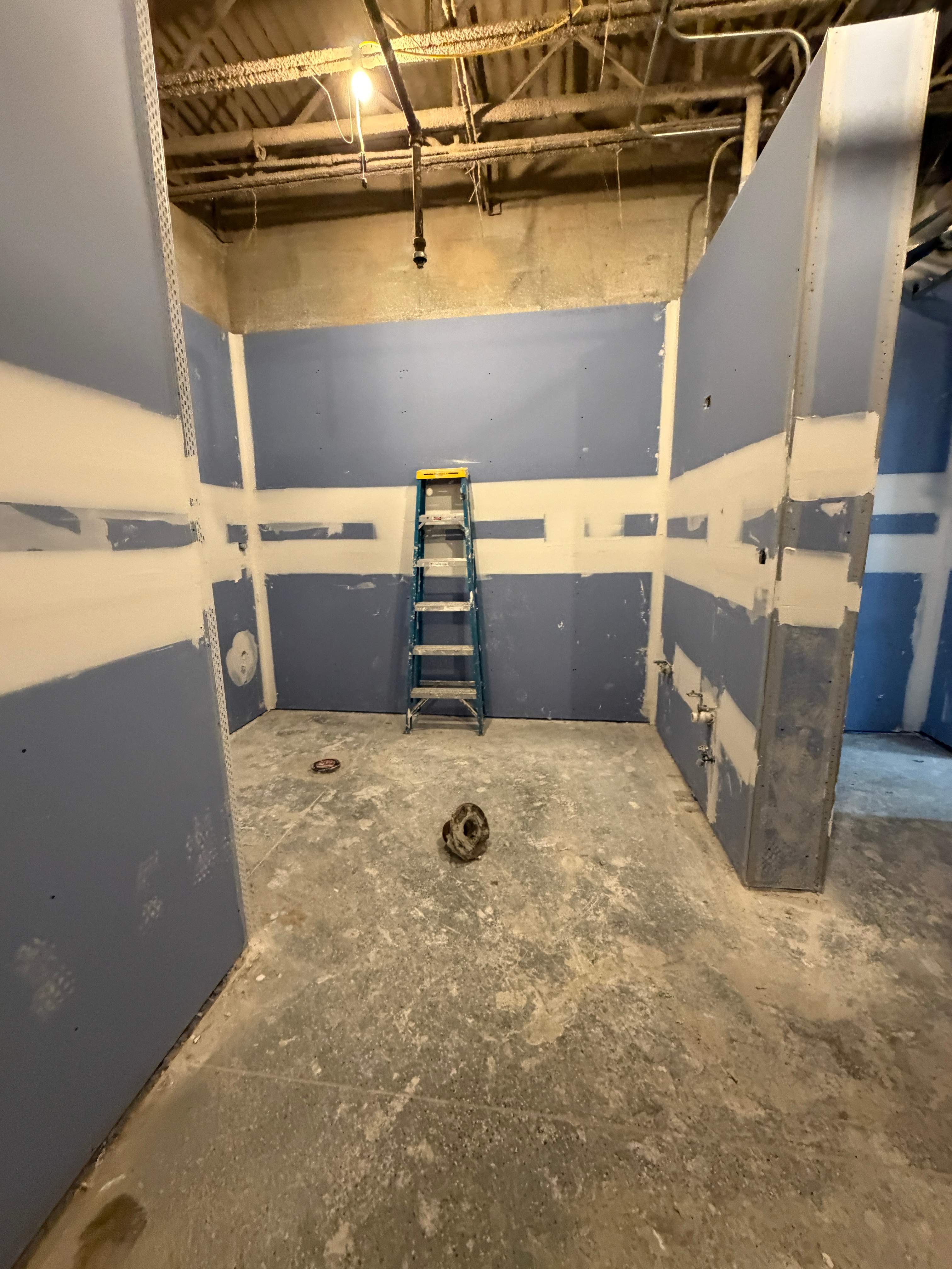 Commercial Restroom Renovation with Epoxy Flooring in Sarasota by Vertical General Contracting 