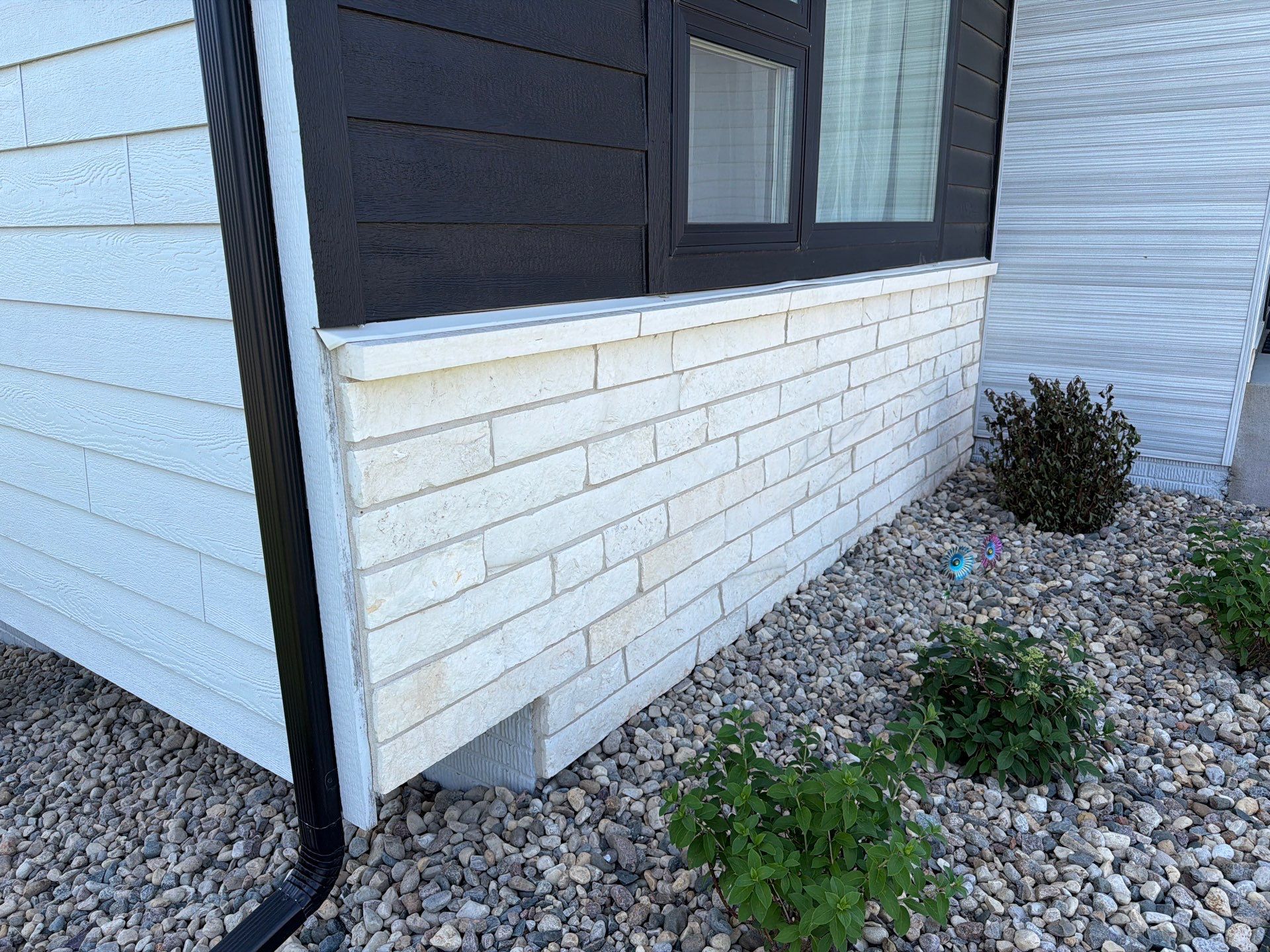 Modern Exterior Update with Siding and Stone Masonry in Sioux Falls by Select Painting, Coatings & Garage Cabinets