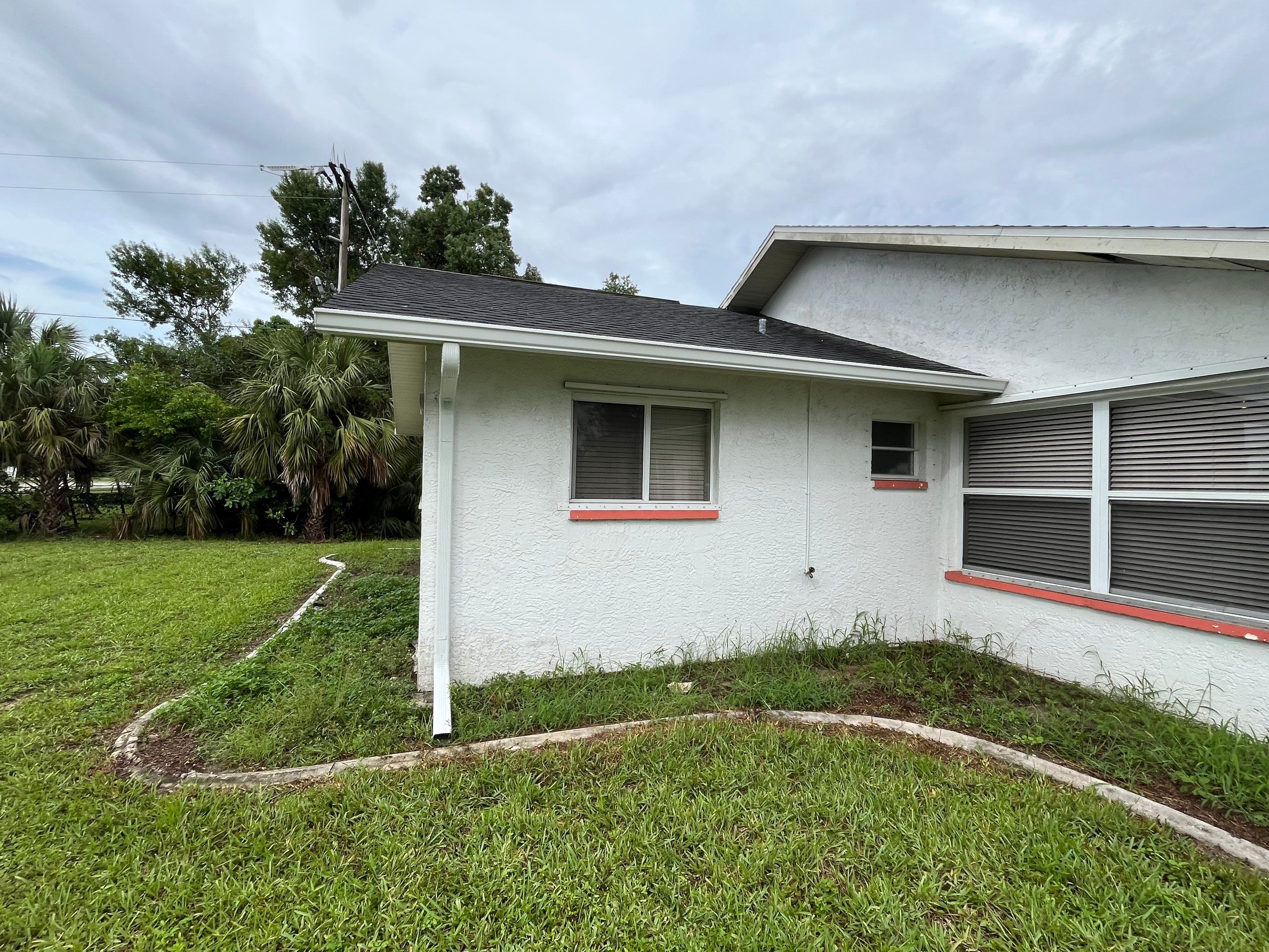 White Seamless Gutters with Splash Guards in North Fort Myers FL by Gutter Professor   by Gutter Professors