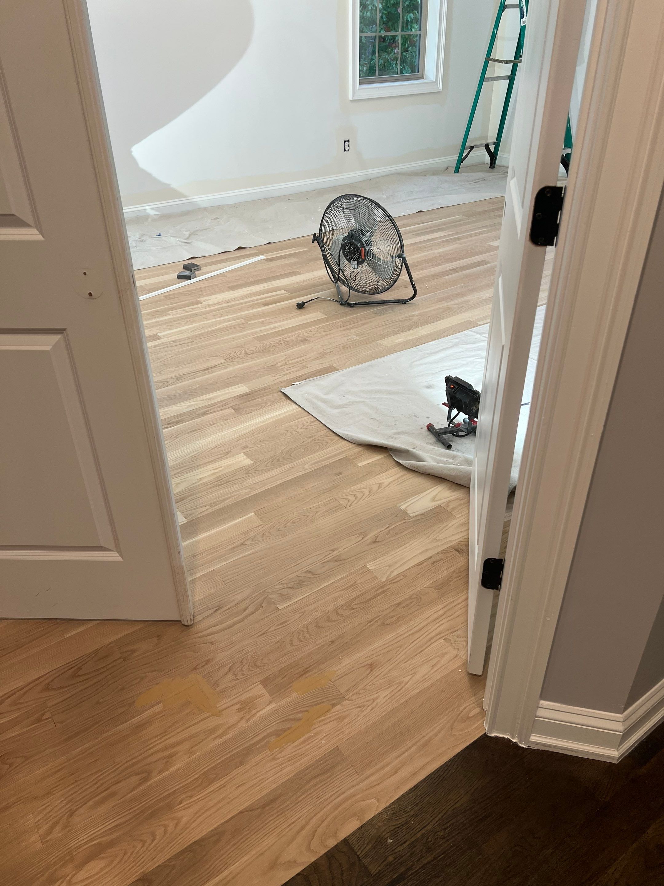 Adding hardwood floors to bedrooms by Accent Custom Floors