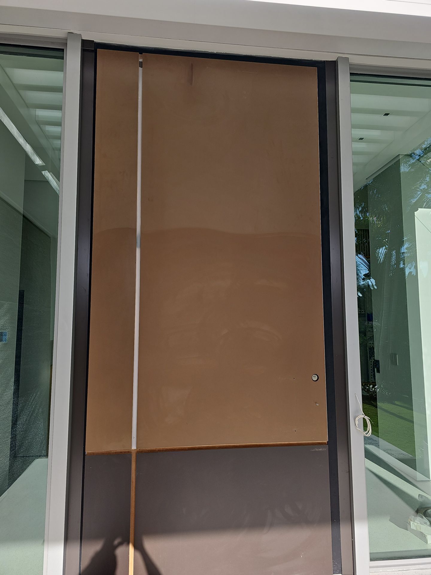 Door Installation using FBS Hurricane Certified Pivot Door by FBS Systems Inc
