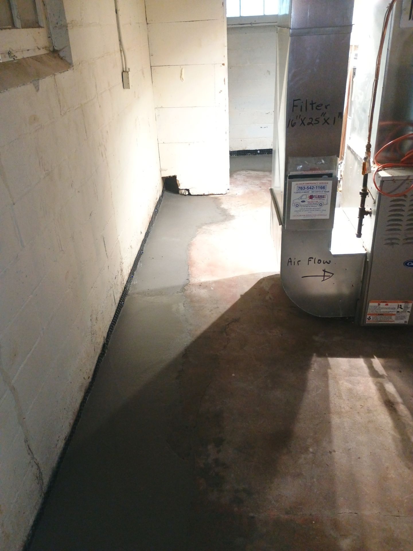 Interior Drain Tile & Sump Pump System in North Minneapolis by Waterproofing Northeast
