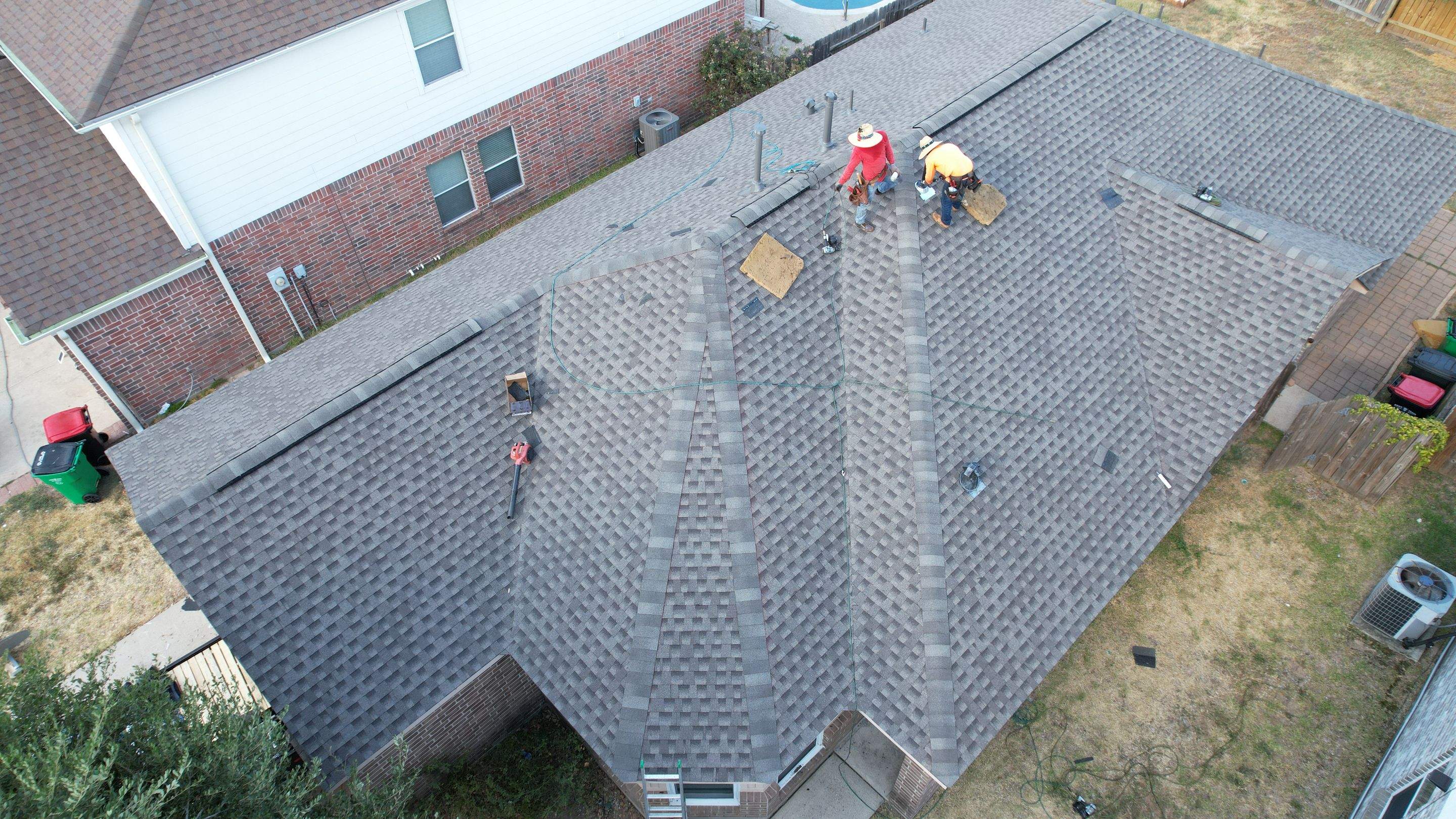 Full Roof Replacement on Two-Story Brick Home — Spring, TX by PL Roofing & SB Roofing, LLC.