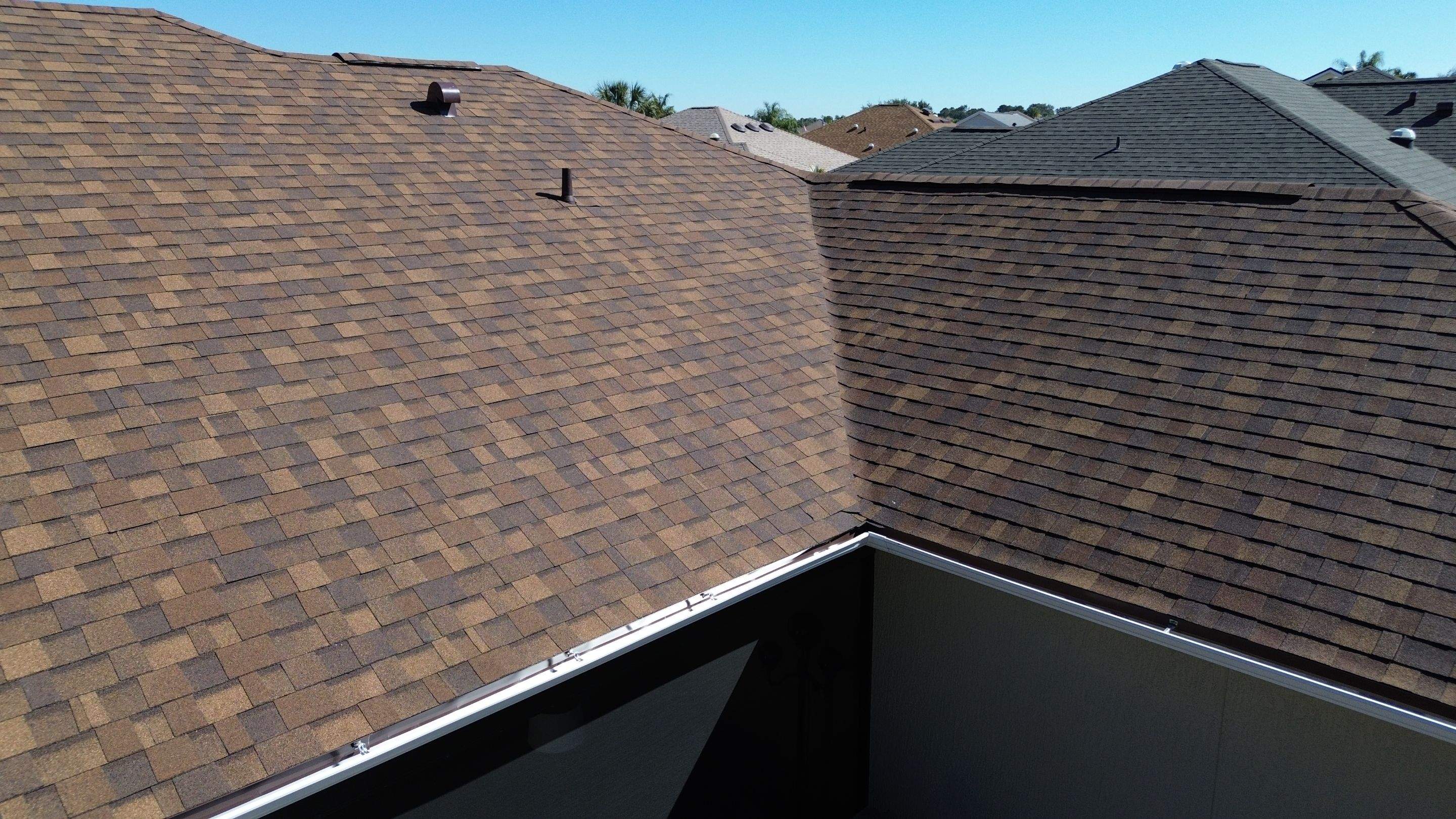 Florida roofers installing shingles by Brehm Roofing