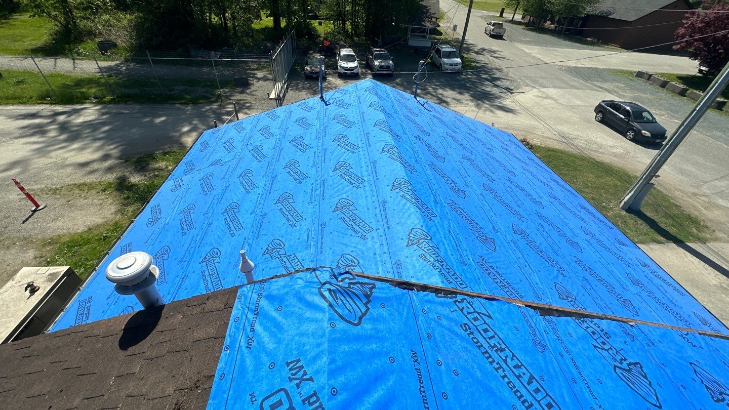 Commercial Roofing Installation using 12" Prolok metal  by Top Notch Roofing Inc