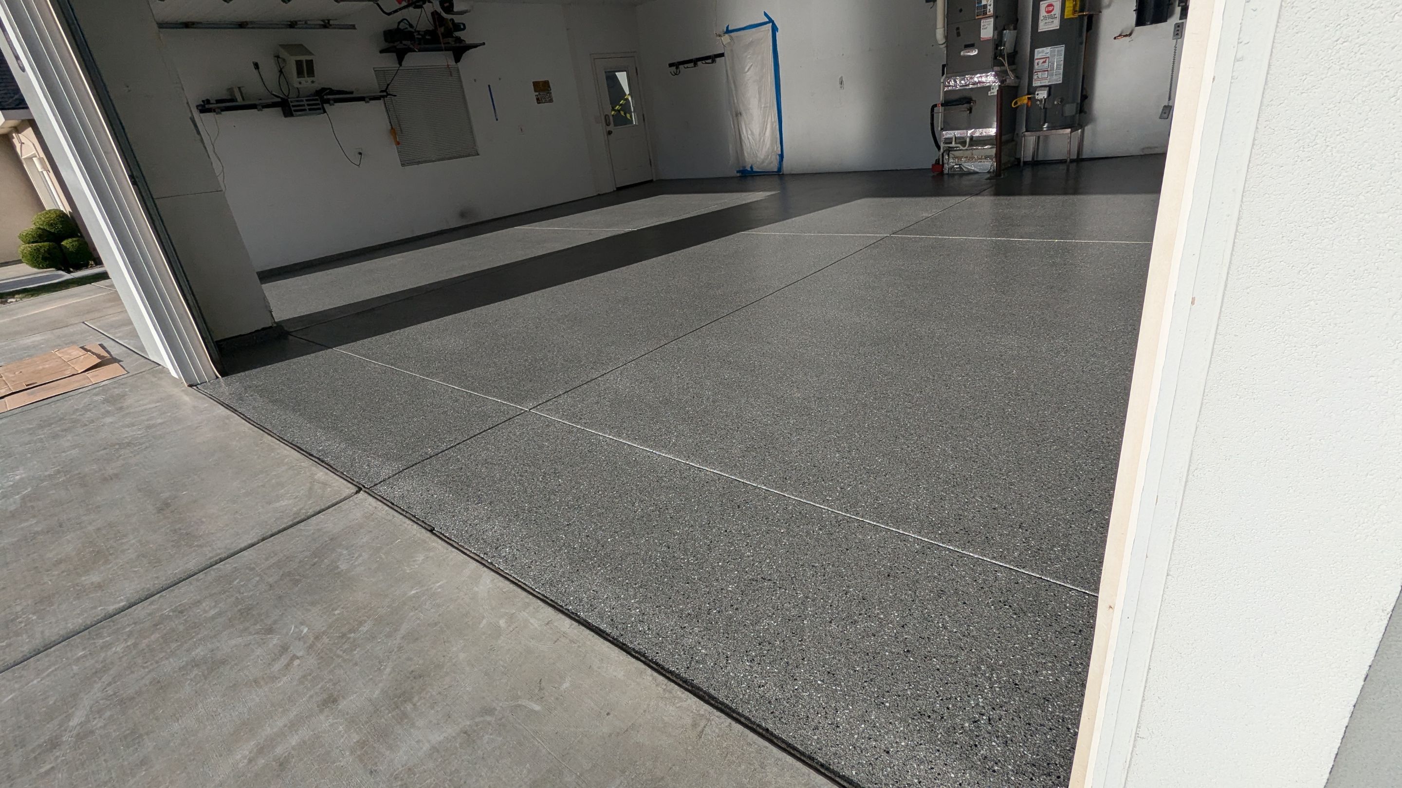 Garage Transformation using Slate Hybrid by Croc Coatings, LLC