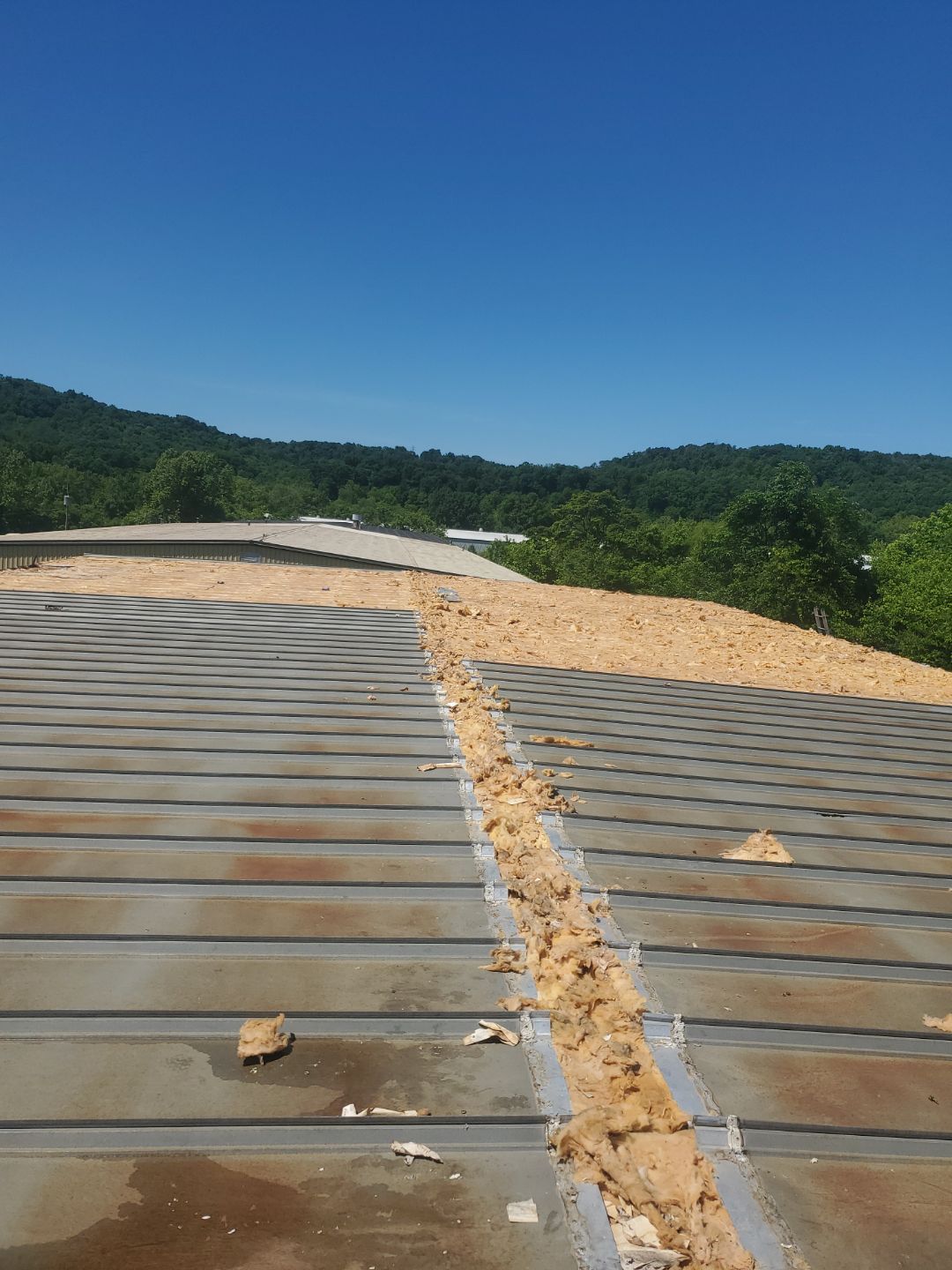 Commercial Roofing Installation using Metal by Rainstoppers Roofing