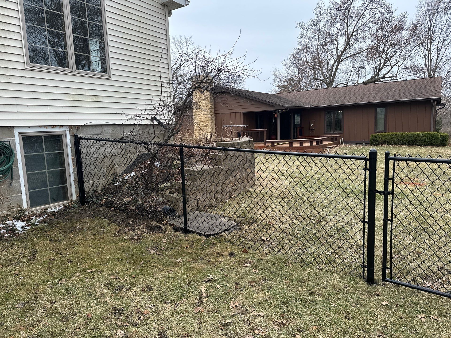 Black Vinyl Chain Link Fence Installation in Cedar Falls by Perfect Picket Fence and Stain