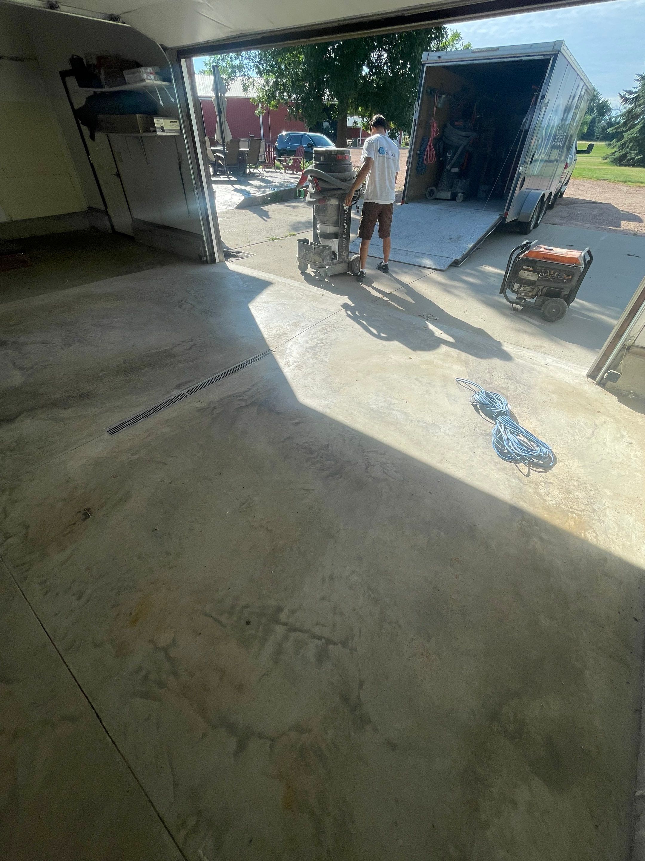 Hartford Residential Garage Floor Transformation With Decorative Chip Coating by Select Painting, Coatings & Garage Cabinets