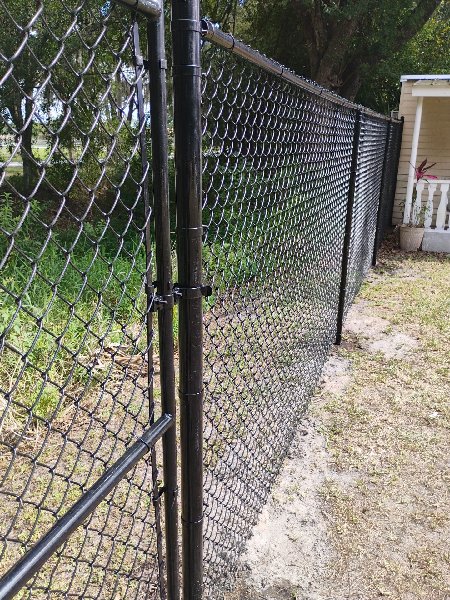 Black Vinyl Chain Link Fence Installation in Arcadia Florida by True Fence LLC