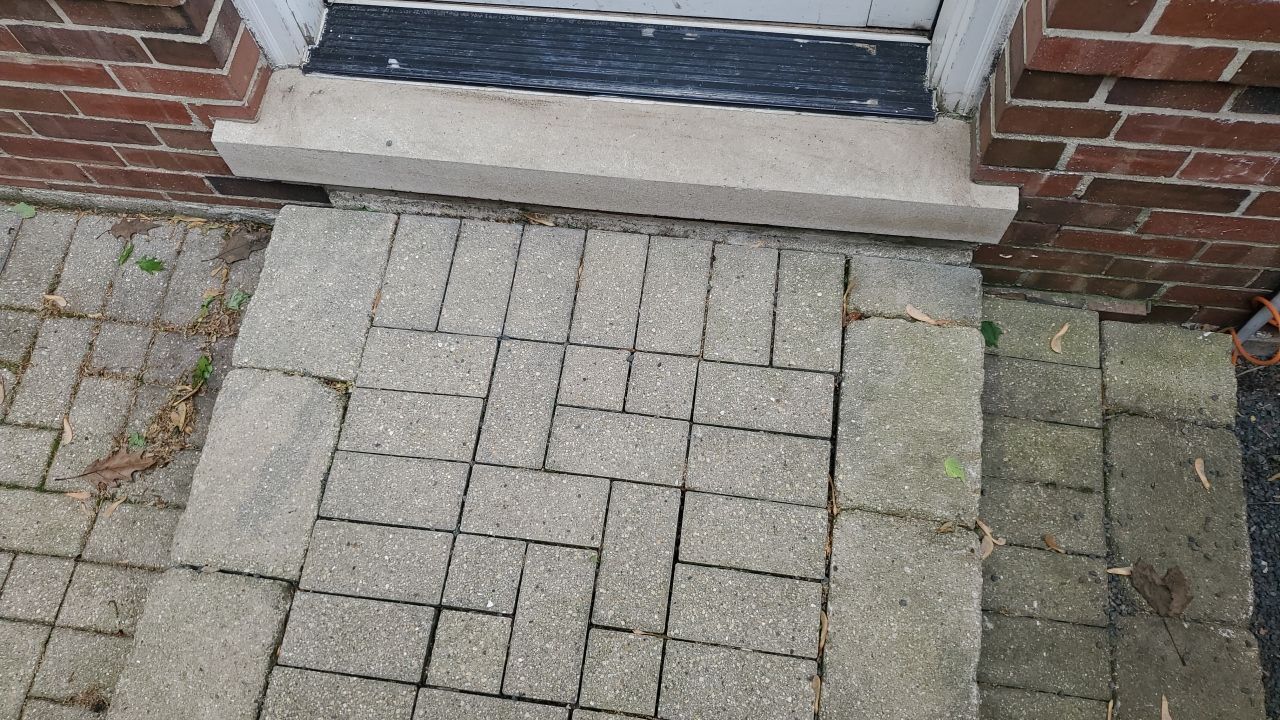 Brick patio repair, clean sand and seal by Northern Power Washing LLC.