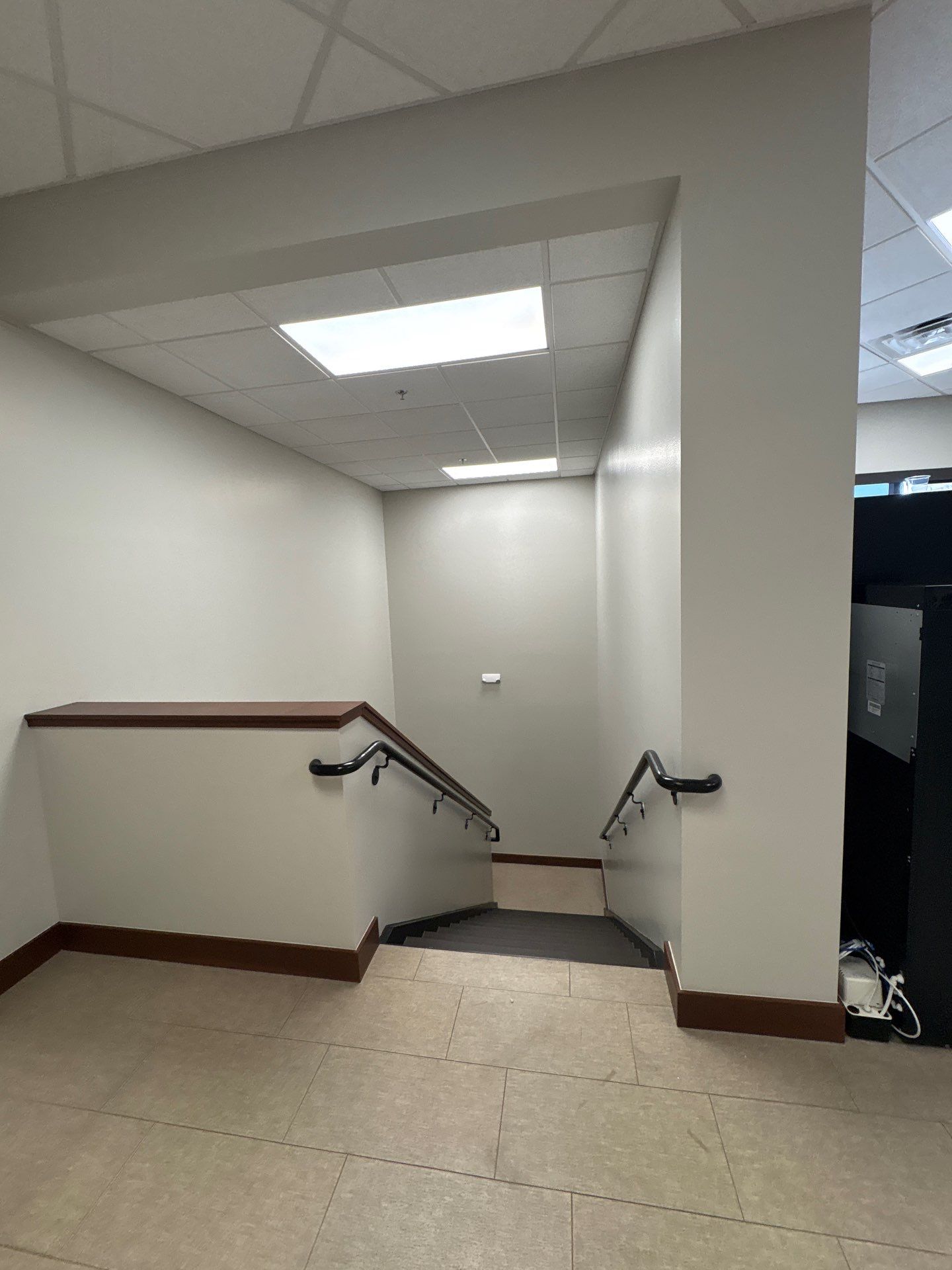 Commercial Office Interior Remodel and Modern Suite Refresh in Sioux Falls by Select Painting, Coatings & Garage Cabinets