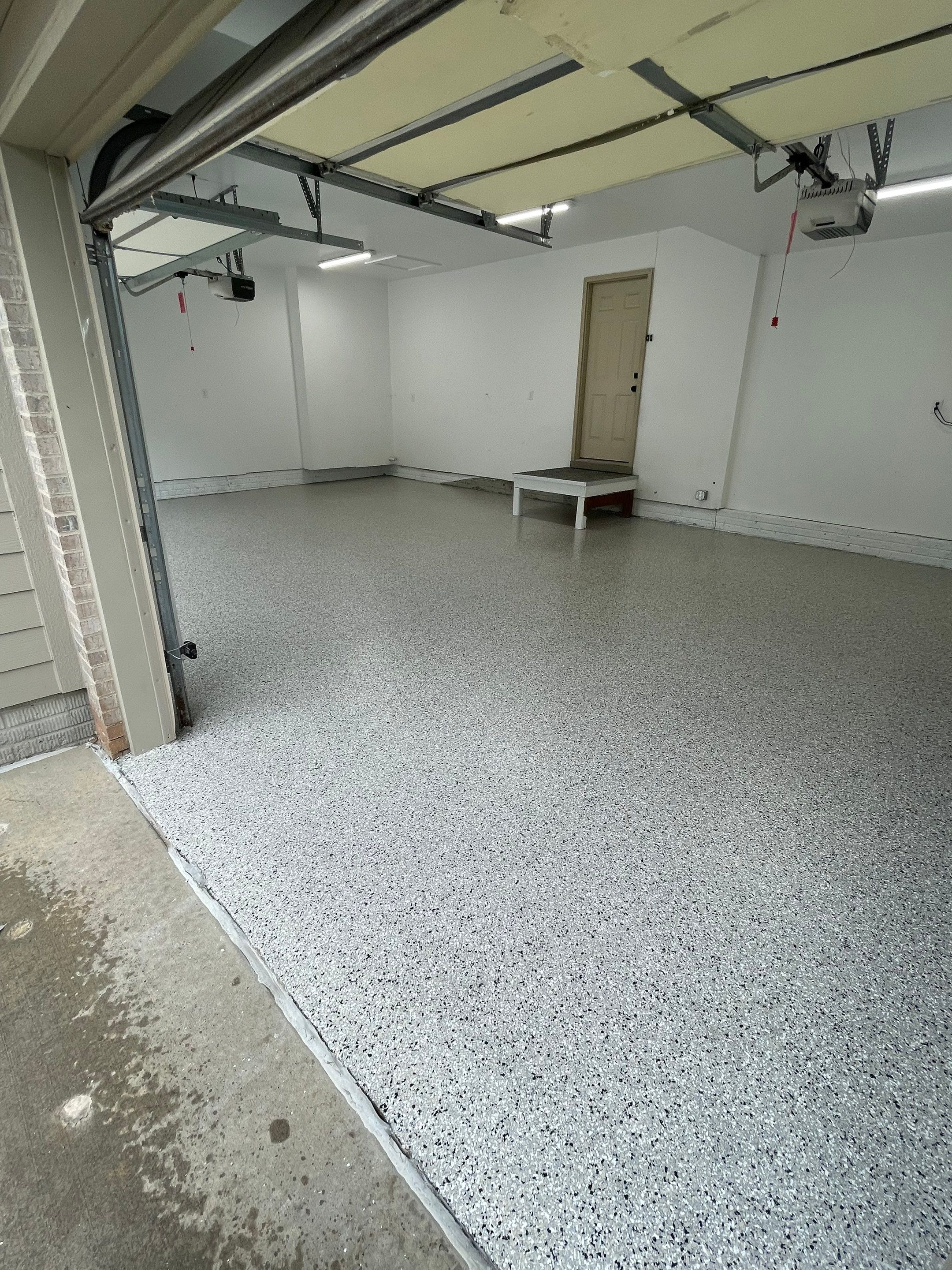 Cabin Fever Garage Floor System in Sioux Falls by Select Painting, Coatings & Garage Cabinets