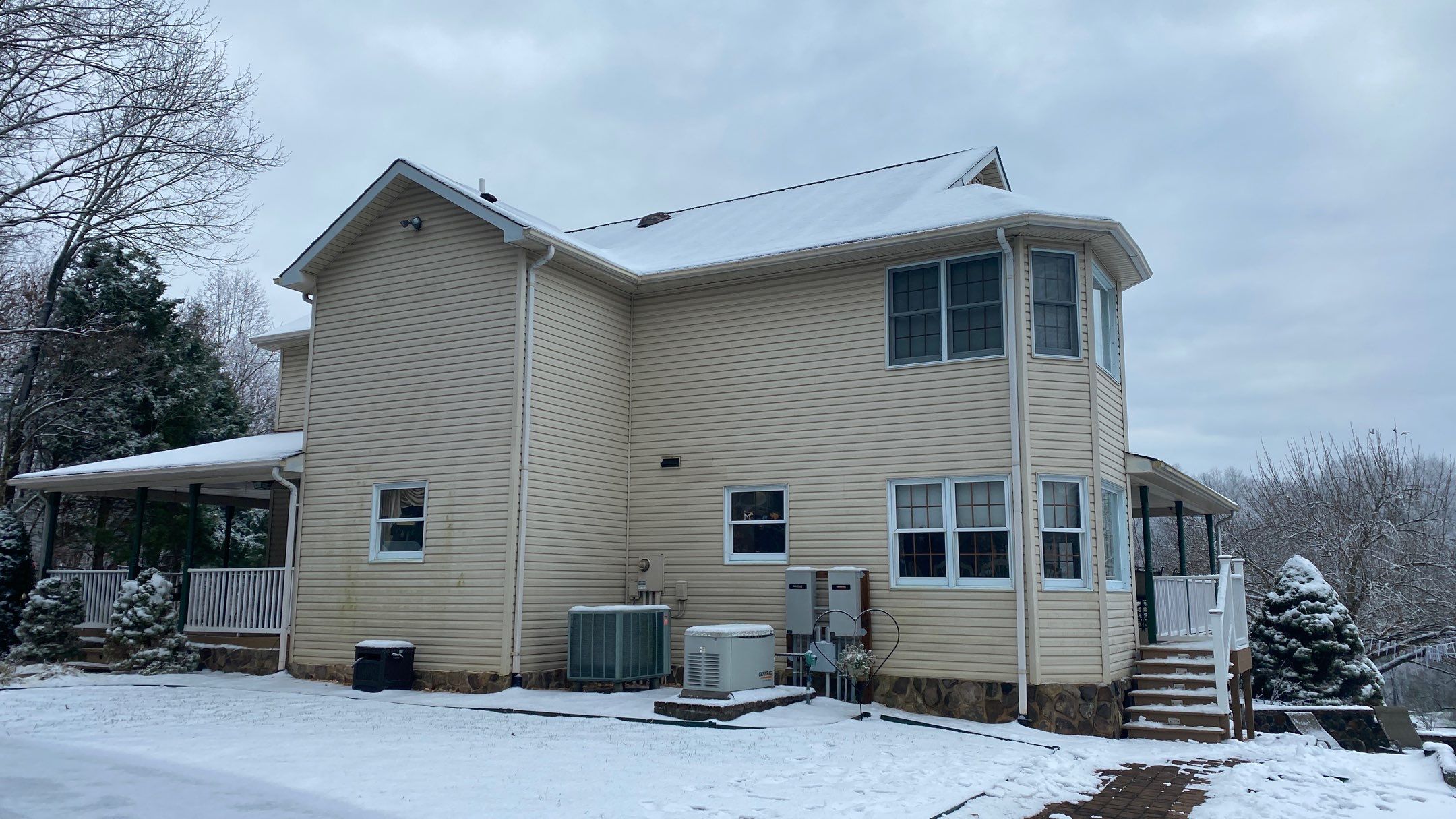 Exterior remodel including window replacement by American Home Contractors