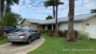 Residential Roofing Installation using 1" Nail strip metal roof