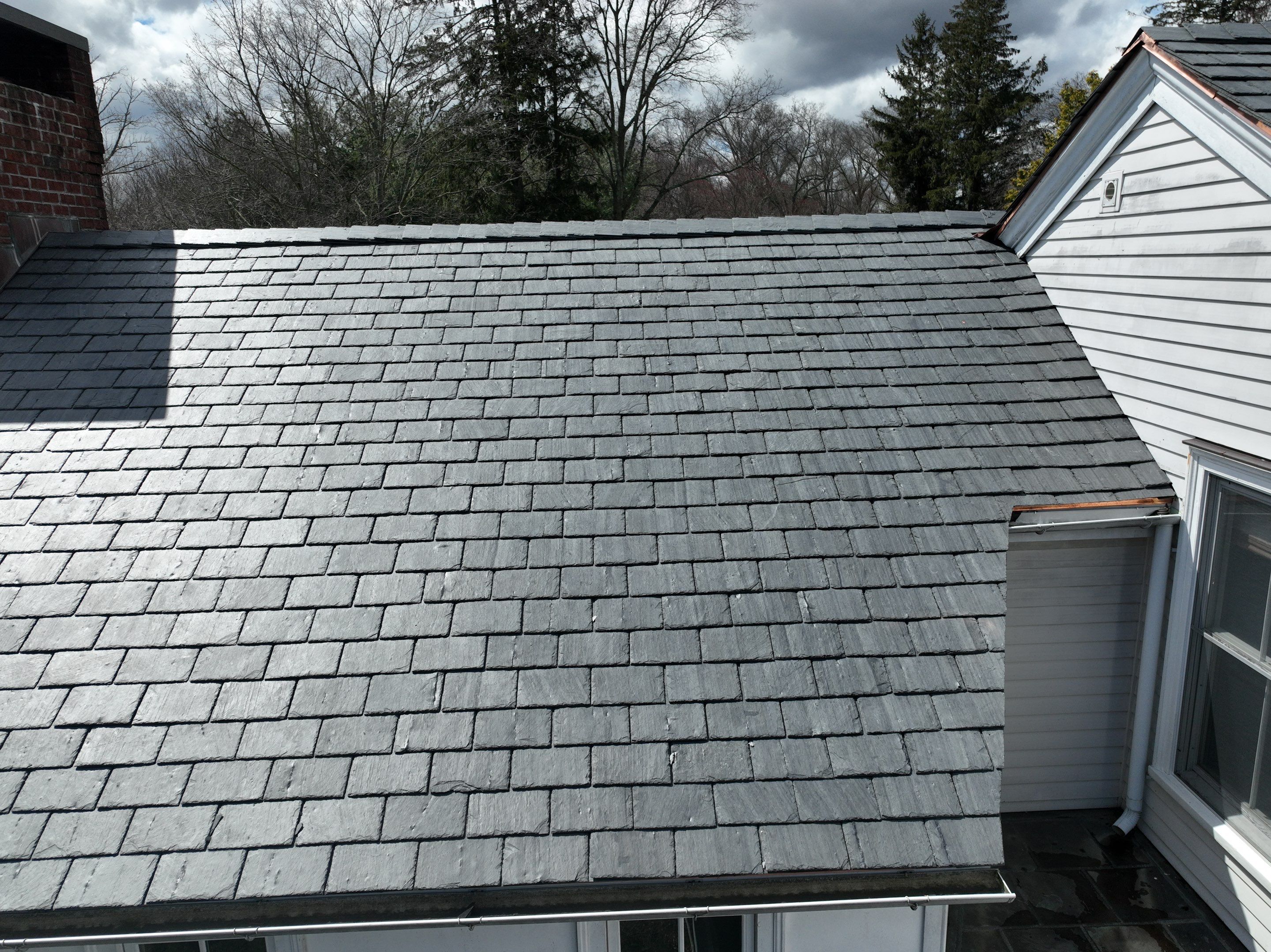 Residential Roofing Installation using Vermont Slate by A Plus Exterior