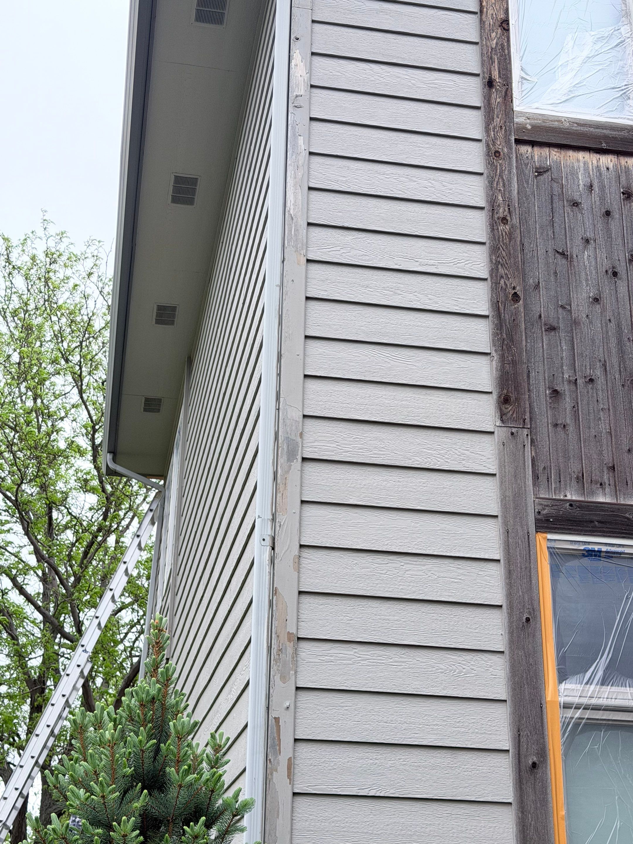 Exterior Siding and Trim Painting for Sioux Falls Residence by Select Painting, Coatings & Garage Cabinets