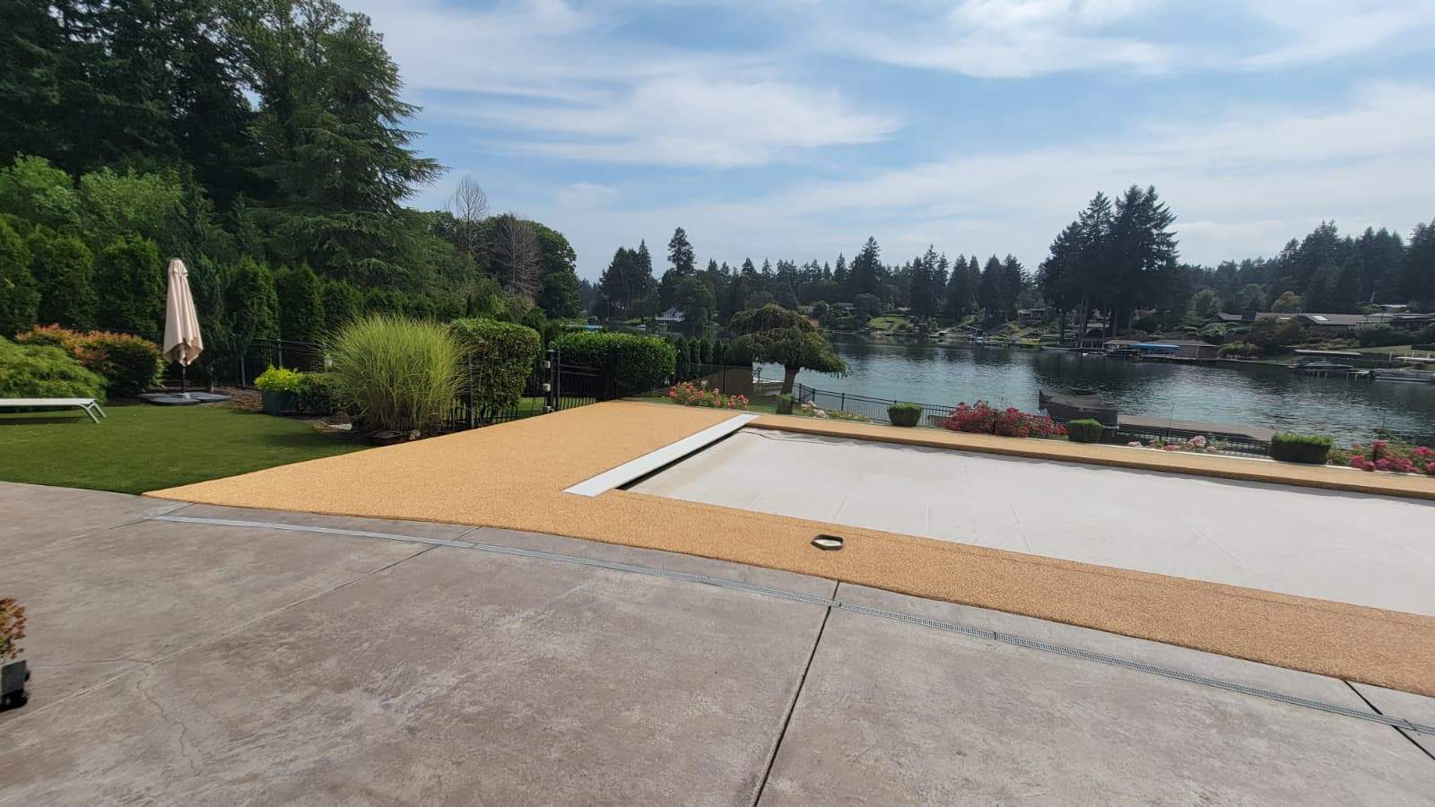 Pool Deck with Rubber Stone Finish by Concrete Coating Experts Inc.