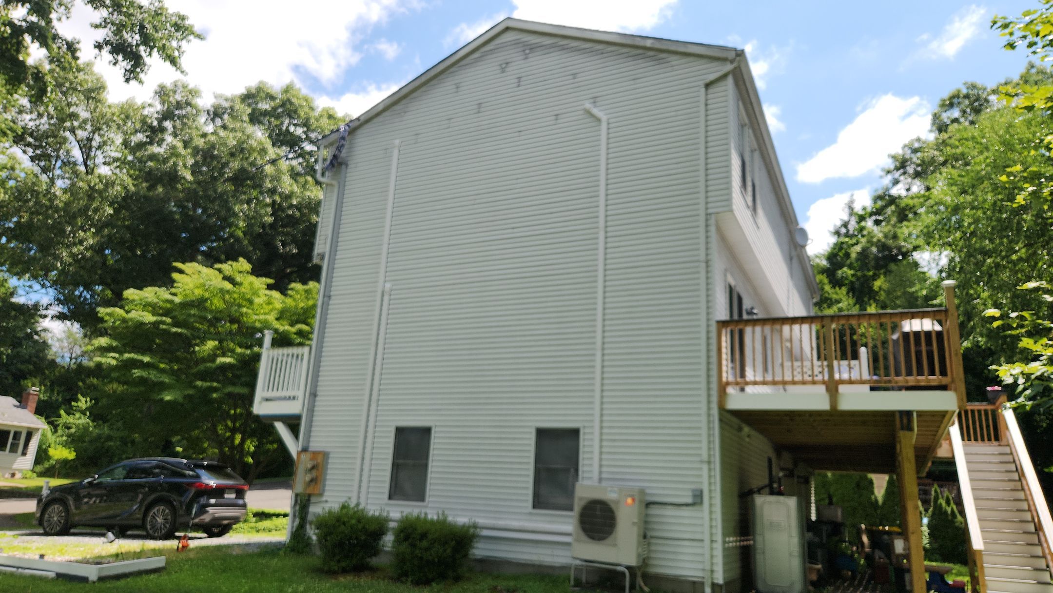 Siding Renewal Using Provia Cedar Peaks D 4.5 in Woodgrain and Tando Brick Panels by DiGiorgi Roofing and Siding Inc