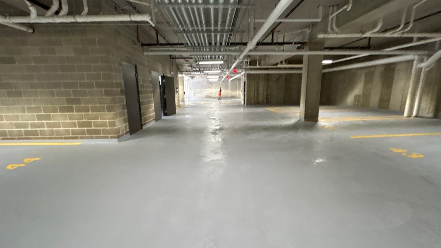 Parking garage using Hot water by Northern Power Washing LLC.